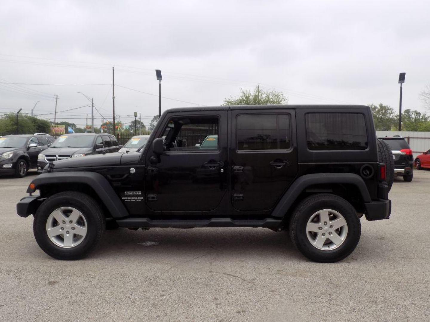 2013 BLACK JEEP WRANGLER UNLIMI SPORT (1C4BJWDG3DL) with an 3.6L engine, Automatic transmission, located at 830 E. Canino Rd., Houston, TX, 77037, (281) 405-0440, 38.358219, -81.729942 - Photo#5
