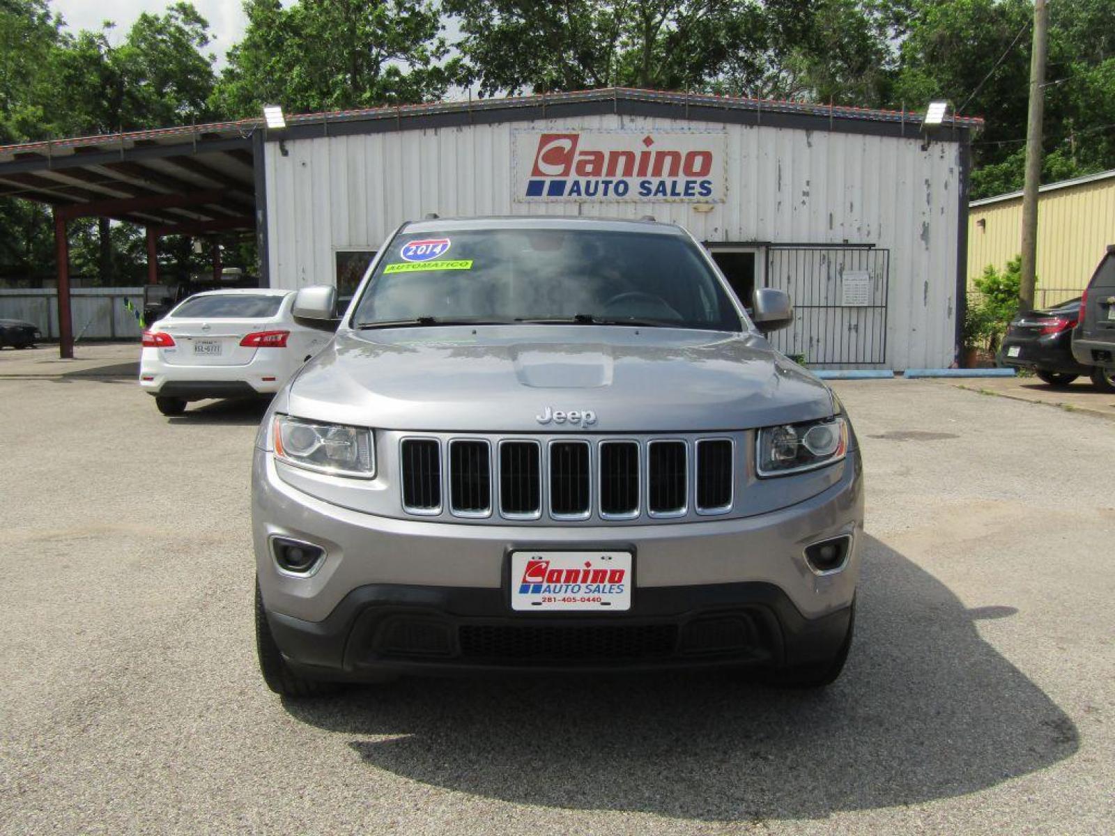 2014 SILVER JEEP GRAND CHEROKEE LAREDO (1C4RJFAG0EC) with an 3.6L engine, Automatic transmission, located at 830 E. Canino Rd., Houston, TX, 77037, (281) 405-0440, 38.358219, -81.729942 - Photo #0