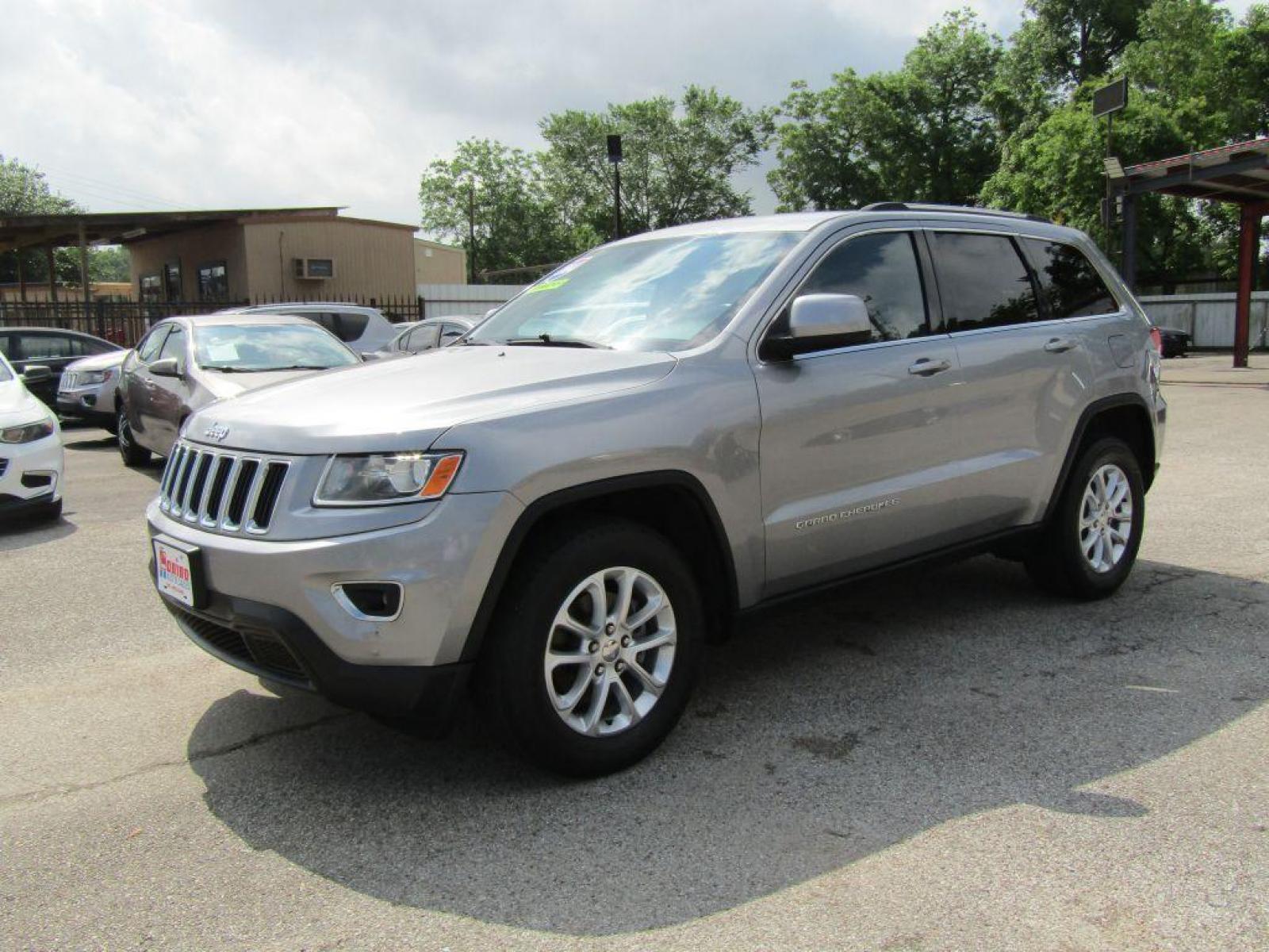 2014 SILVER JEEP GRAND CHEROKEE LAREDO (1C4RJFAG0EC) with an 3.6L engine, Automatic transmission, located at 830 E. Canino Rd., Houston, TX, 77037, (281) 405-0440, 38.358219, -81.729942 - Photo #1