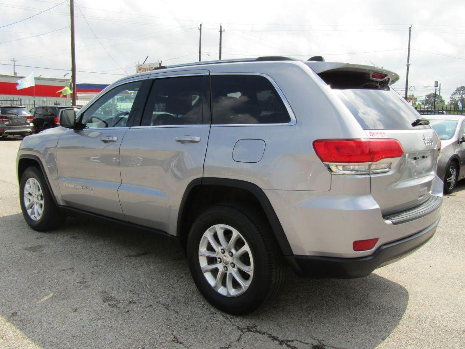 2014 SILVER JEEP GRAND CHEROKEE LAREDO (1C4RJFAG0EC) with an 3.6L engine, Automatic transmission, located at 830 E. Canino Rd., Houston, TX, 77037, (281) 405-0440, 38.358219, -81.729942 - Photo #2