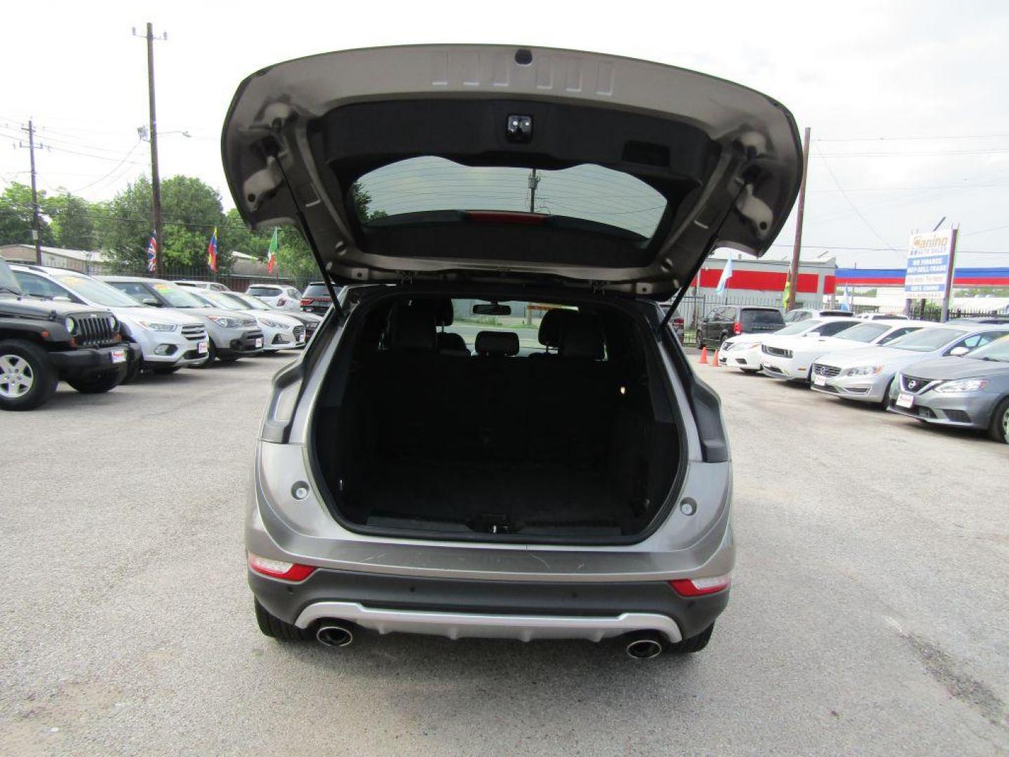 2016 BROWN LINCOLN MKC PREMIERE (5LMCJ1C94GU) with an 2.0L engine, Automatic transmission, located at 830 E. Canino Rd., Houston, TX, 77037, (281) 405-0440, 38.358219, -81.729942 - $1900+TT and L - Photo#10
