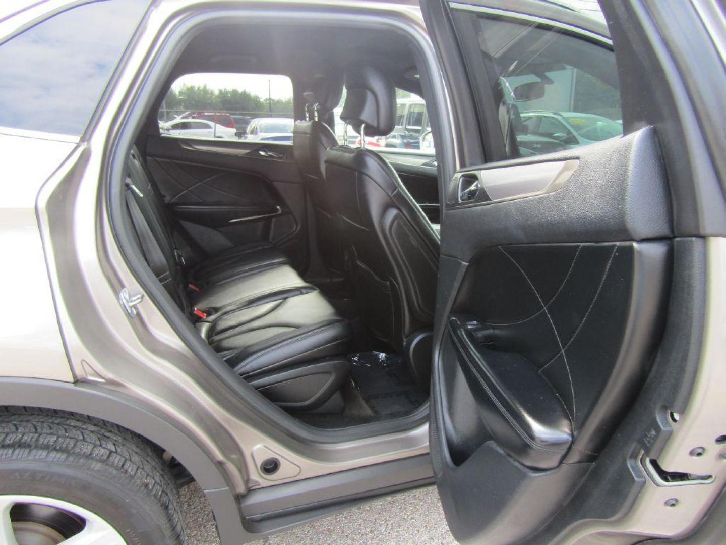 2016 BROWN LINCOLN MKC PREMIERE (5LMCJ1C94GU) with an 2.0L engine, Automatic transmission, located at 830 E. Canino Rd., Houston, TX, 77037, (281) 405-0440, 38.358219, -81.729942 - $1900+TT and L - Photo#12
