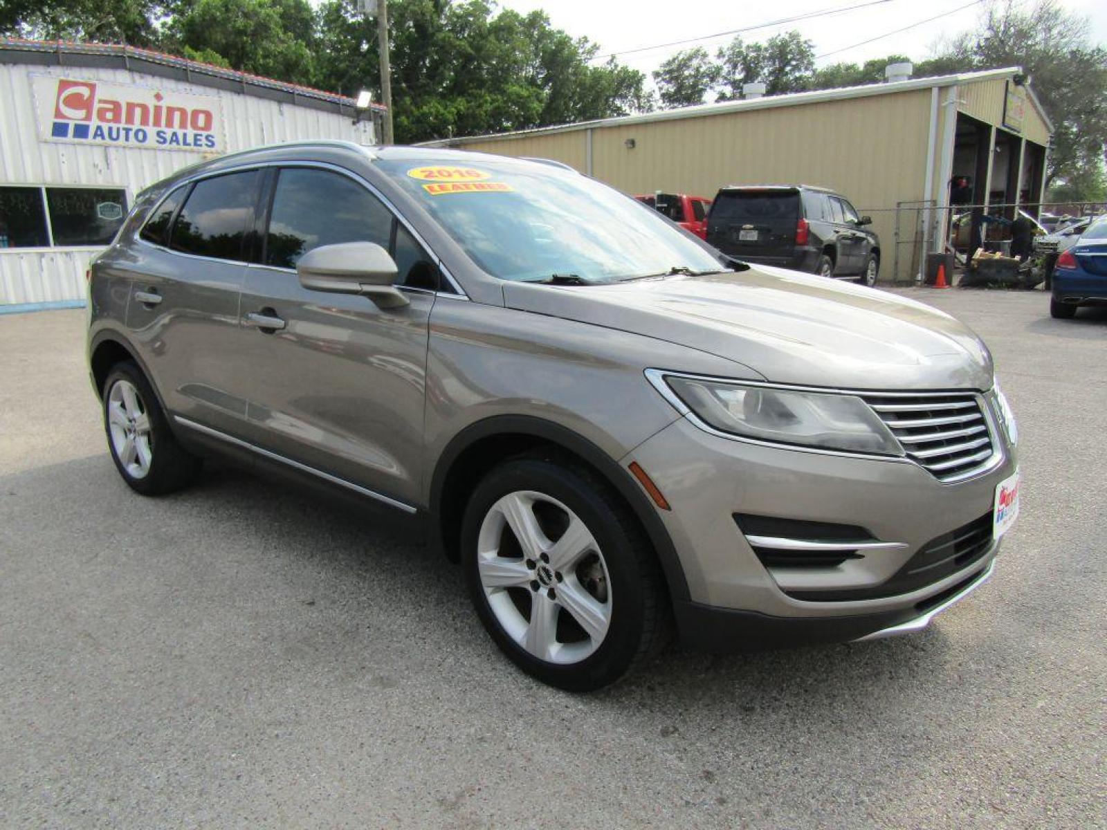 2016 BROWN LINCOLN MKC PREMIERE (5LMCJ1C94GU) with an 2.0L engine, Automatic transmission, located at 830 E. Canino Rd., Houston, TX, 77037, (281) 405-0440, 38.358219, -81.729942 - $1900+TT and L - Photo #1