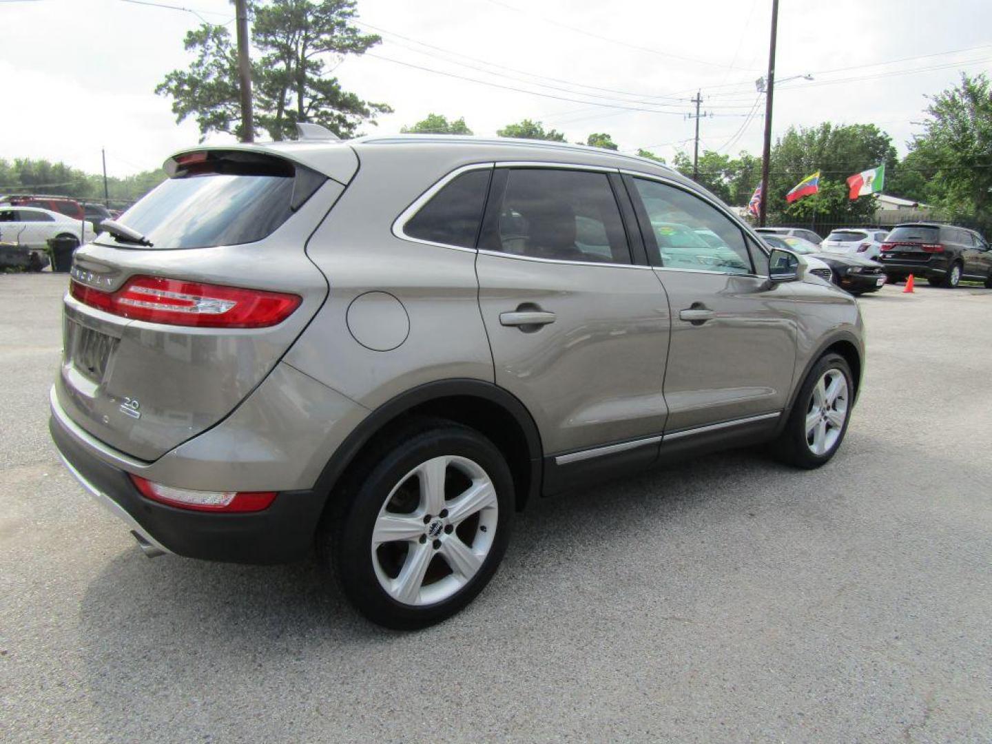 2016 BROWN LINCOLN MKC PREMIERE (5LMCJ1C94GU) with an 2.0L engine, Automatic transmission, located at 830 E. Canino Rd., Houston, TX, 77037, (281) 405-0440, 38.358219, -81.729942 - $1900+TT and L - Photo#2