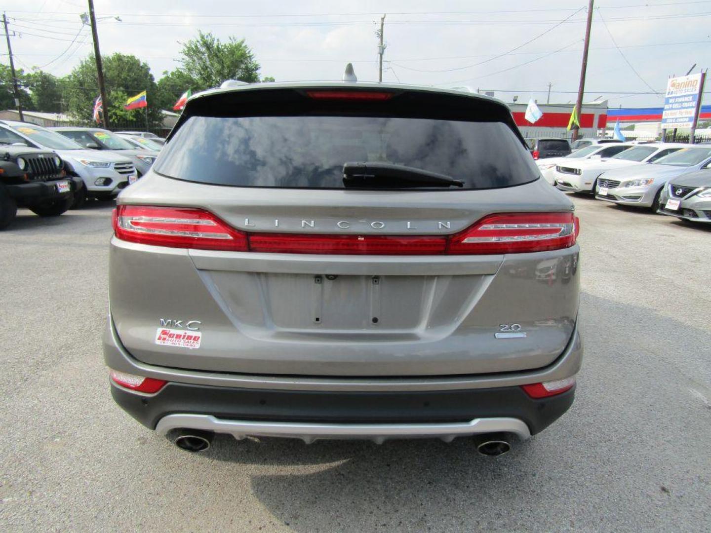 2016 BROWN LINCOLN MKC PREMIERE (5LMCJ1C94GU) with an 2.0L engine, Automatic transmission, located at 830 E. Canino Rd., Houston, TX, 77037, (281) 405-0440, 38.358219, -81.729942 - $1900+TT and L - Photo#3