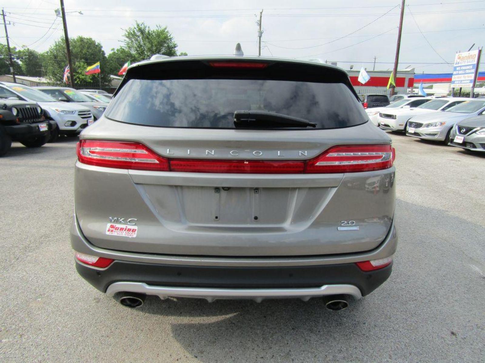 2016 BROWN LINCOLN MKC PREMIERE (5LMCJ1C94GU) with an 2.0L engine, Automatic transmission, located at 830 E. Canino Rd., Houston, TX, 77037, (281) 405-0440, 38.358219, -81.729942 - $1900+TT and L - Photo #3