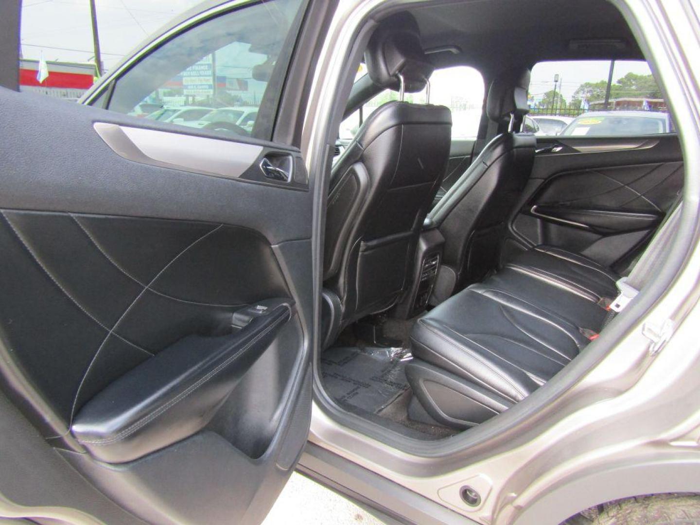 2016 BROWN LINCOLN MKC PREMIERE (5LMCJ1C94GU) with an 2.0L engine, Automatic transmission, located at 830 E. Canino Rd., Houston, TX, 77037, (281) 405-0440, 38.358219, -81.729942 - $1900+TT and L - Photo#8