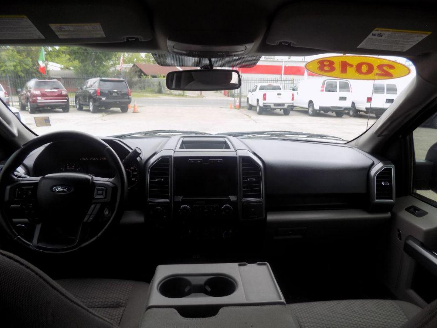 2018 WHITE FORD F150 SUPERCREW (1FTFW1E58JK) with an 5.0L engine, Automatic transmission, located at 830 E. Canino Rd., Houston, TX, 77037, (281) 405-0440, 38.358219, -81.729942 - VENGA A VISITARNOS A CANINO AUTO SALES. ENTRE CAMINANDO Y SALGA MANEJANDO. APROVACION GARANTIZADA CON REQUISITOS MINIMOS! PREGUNTEN POR JESSICA, MAY, O CARRIE PARA SU APROBACION SEGURA. ??830 E CANINO RD HOUSTON TX 77037 ??(281) 405-0440 come visit us today!! walk in/ drive out in minutes! - Photo#16