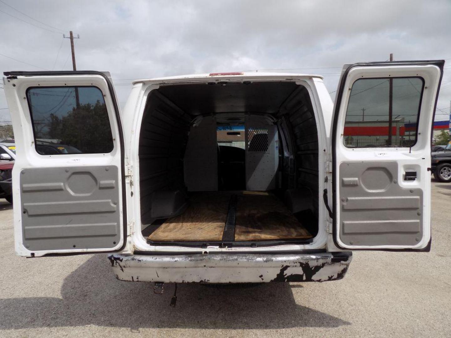 2005 WHITE FORD ECONOLINE E250 VAN (1FTNS24L35H) with an 5.4L engine, Automatic transmission, located at 830 E. Canino Rd., Houston, TX, 77037, (281) 405-0440, 38.358219, -81.729942 - Photo#11