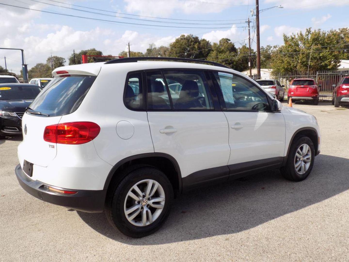 2016 WHITE VOLKSWAGEN TIGUAN S (WVGAV7AX4GW) with an 2.0L engine, Automatic transmission, located at 830 E. Canino Rd., Houston, TX, 77037, (281) 405-0440, 38.358219, -81.729942 - Photo#5