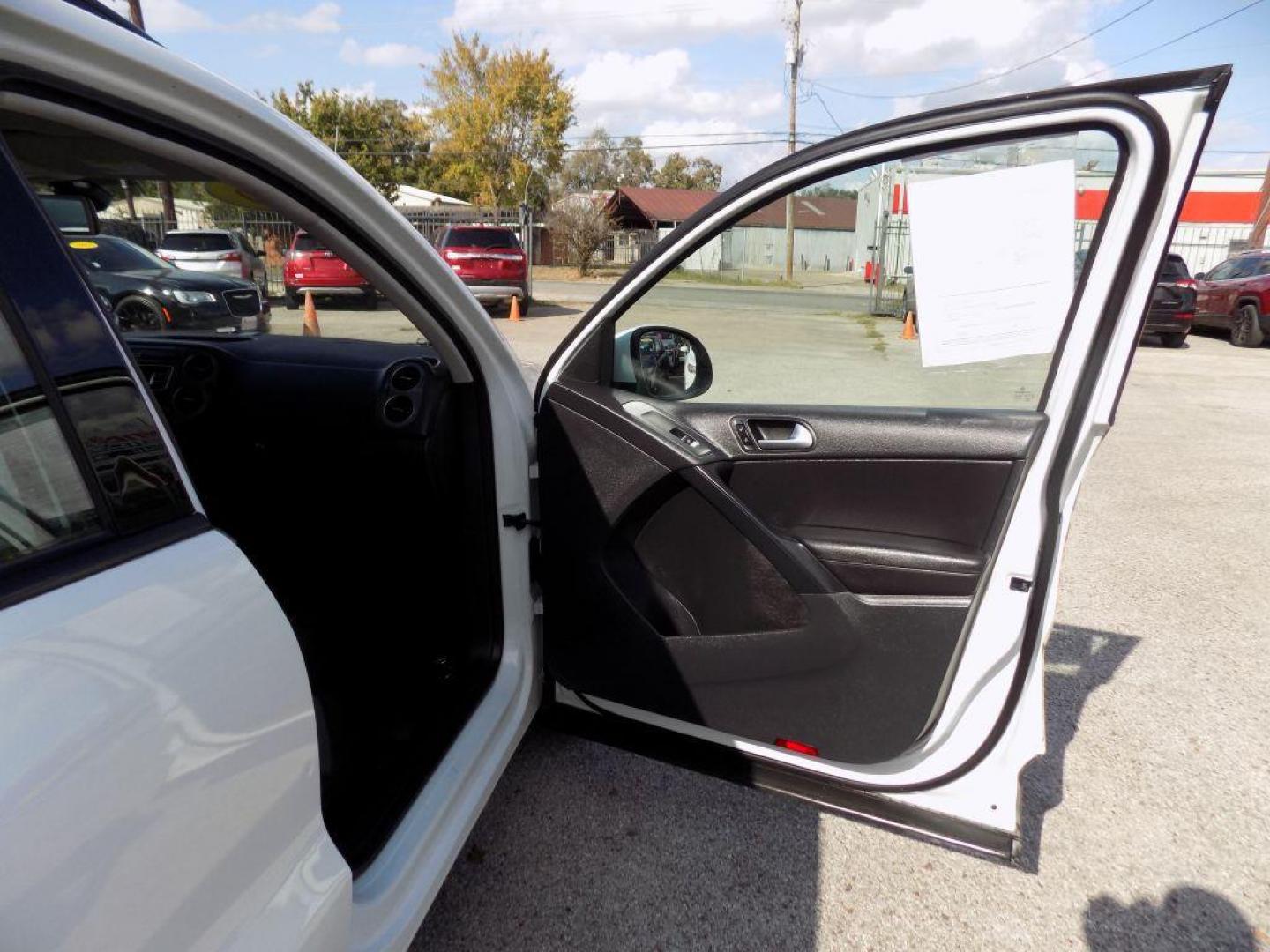 2016 WHITE VOLKSWAGEN TIGUAN S (WVGAV7AX4GW) with an 2.0L engine, Automatic transmission, located at 830 E. Canino Rd., Houston, TX, 77037, (281) 405-0440, 38.358219, -81.729942 - Photo#10