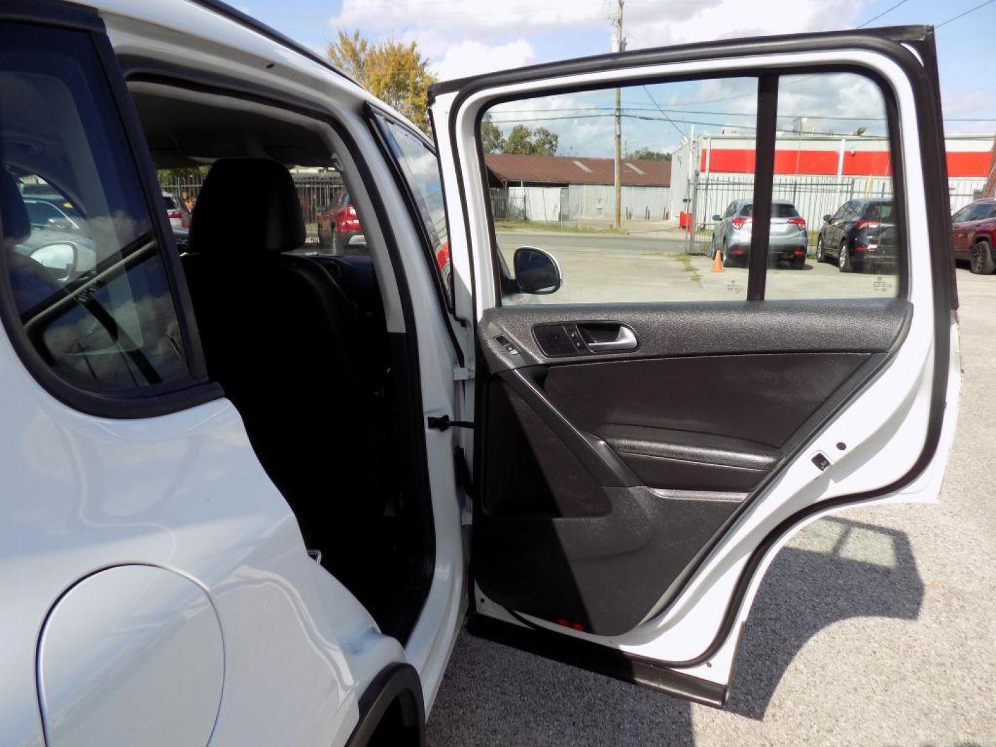2016 WHITE VOLKSWAGEN TIGUAN S (WVGAV7AX4GW) with an 2.0L engine, Automatic transmission, located at 830 E. Canino Rd., Houston, TX, 77037, (281) 405-0440, 38.358219, -81.729942 - Photo#11
