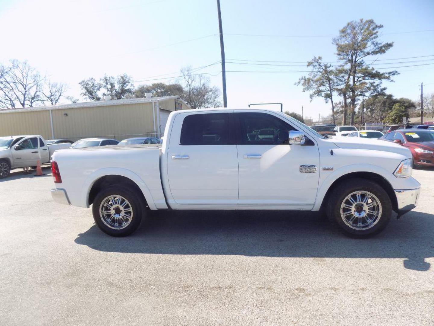 2015 WHITE RAM 1500 LONGHORN (1C6RR6PT9FS) with an 5.7L engine, Automatic transmission, located at 830 E. Canino Rd., Houston, TX, 77037, (281) 405-0440, 38.358219, -81.729942 - Photo#1