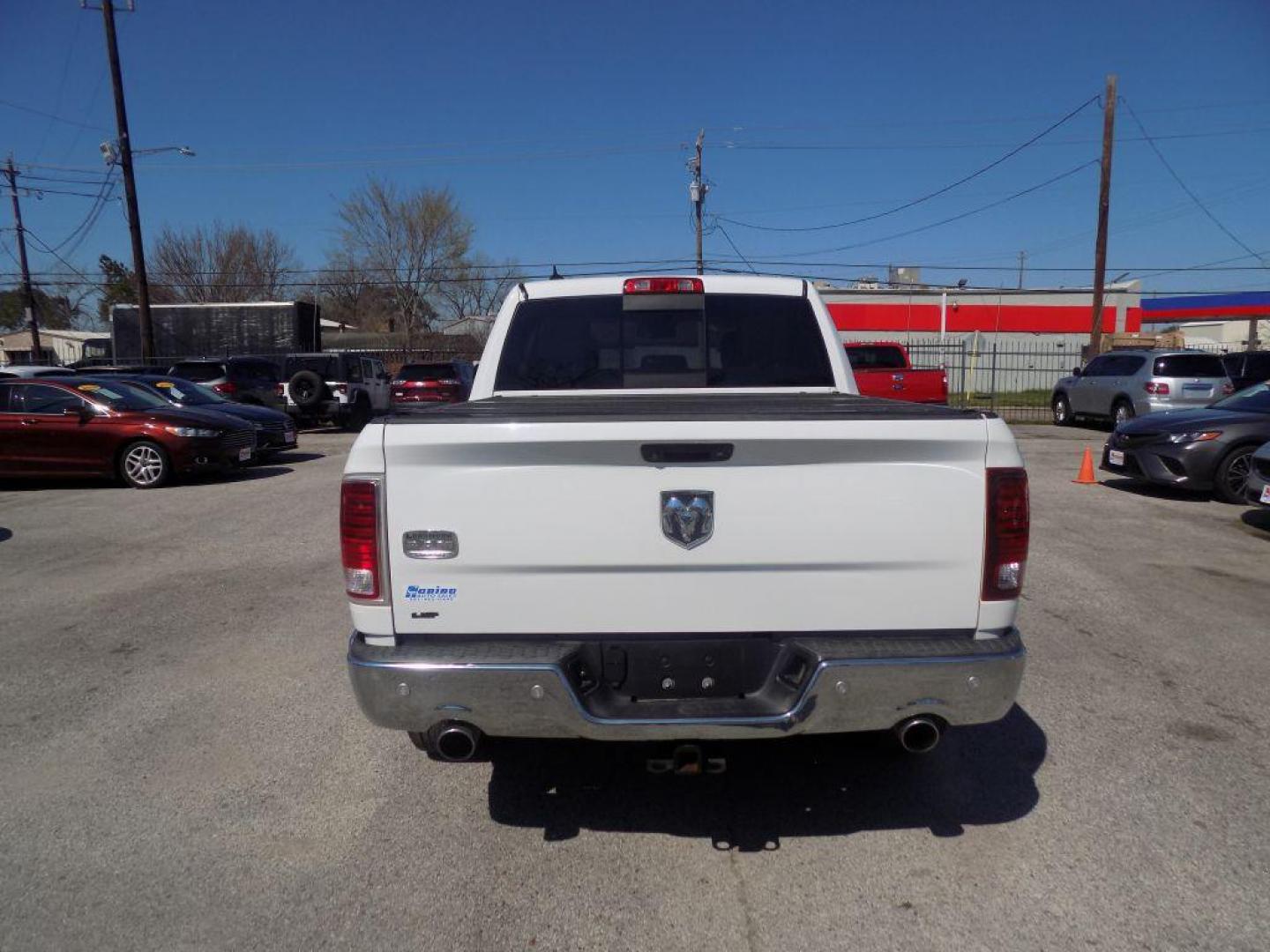 2015 WHITE RAM 1500 LONGHORN (1C6RR6PT9FS) with an 5.7L engine, Automatic transmission, located at 830 E. Canino Rd., Houston, TX, 77037, (281) 405-0440, 38.358219, -81.729942 - Photo#2