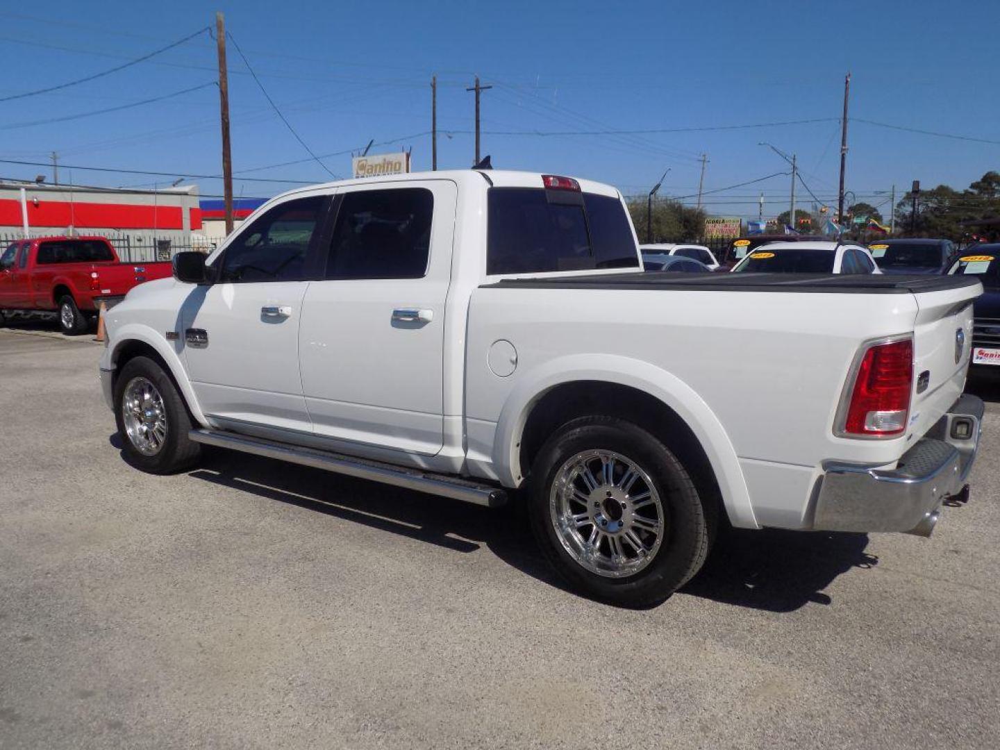 2015 WHITE RAM 1500 LONGHORN (1C6RR6PT9FS) with an 5.7L engine, Automatic transmission, located at 830 E. Canino Rd., Houston, TX, 77037, (281) 405-0440, 38.358219, -81.729942 - Photo#4