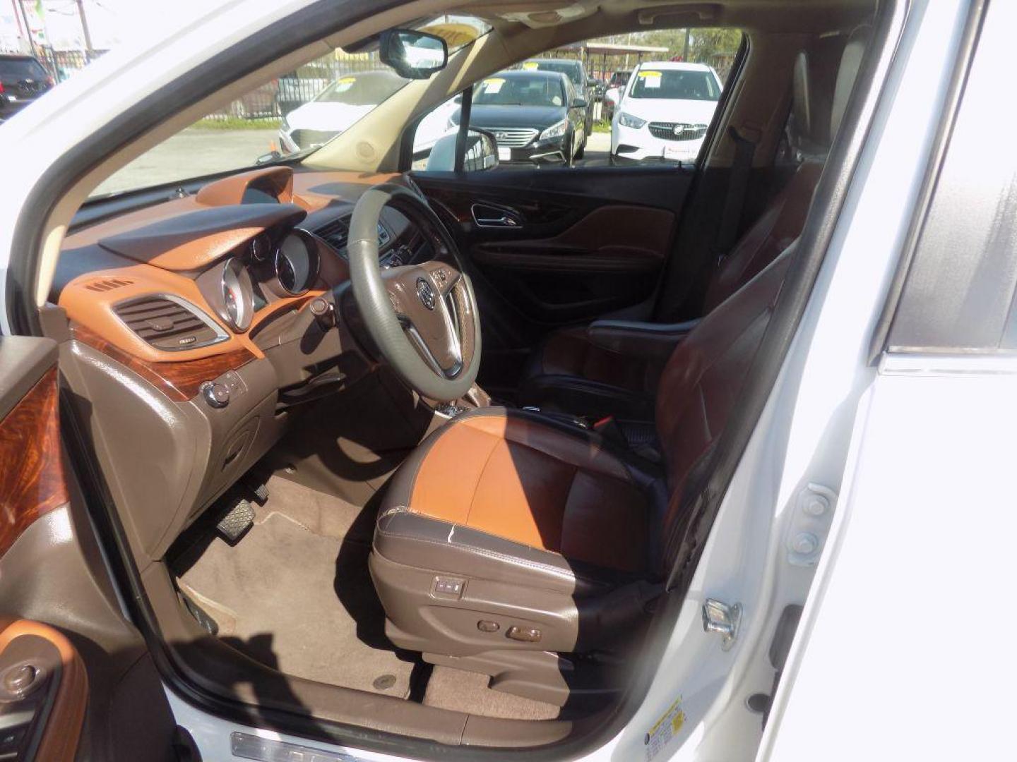 2015 WHITE BUICK ENCORE (KL4CJCSBXFB) with an 1.4L engine, Automatic transmission, located at 830 E. Canino Rd., Houston, TX, 77037, (281) 405-0440, 38.358219, -81.729942 - PRE APPROVACION FACIL, RAPIDA.... PROCESSO RAPIDO LLAMA O VISITANOS HOY MISMO ESTAMOS LOCALIZADOS EN EL 830 E. CANINO RD (ESQUINA CON AIRLINE) HOUSTON, TEXAS 777037 SU TRABAJO ES SU CREDITO!! ENTRE CAMINANDO Y SALGA MANEJANDO! LLAME YA AL (281) 405-0440 LE ESPERAMOS! - Photo#16