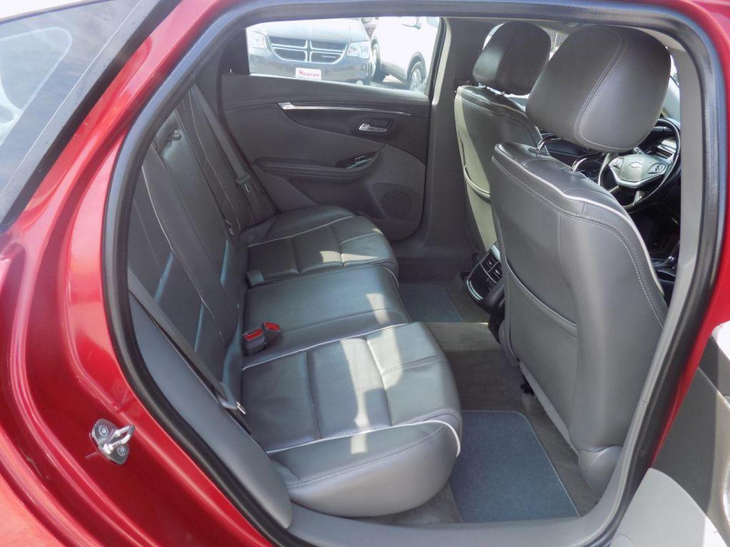 2015 RED CHEVROLET IMPALA LTZ (1G1165S38FU) with an 3.6L engine, Automatic transmission, located at 830 E. Canino Rd., Houston, TX, 77037, (281) 405-0440, 38.358219, -81.729942 - Photo#11