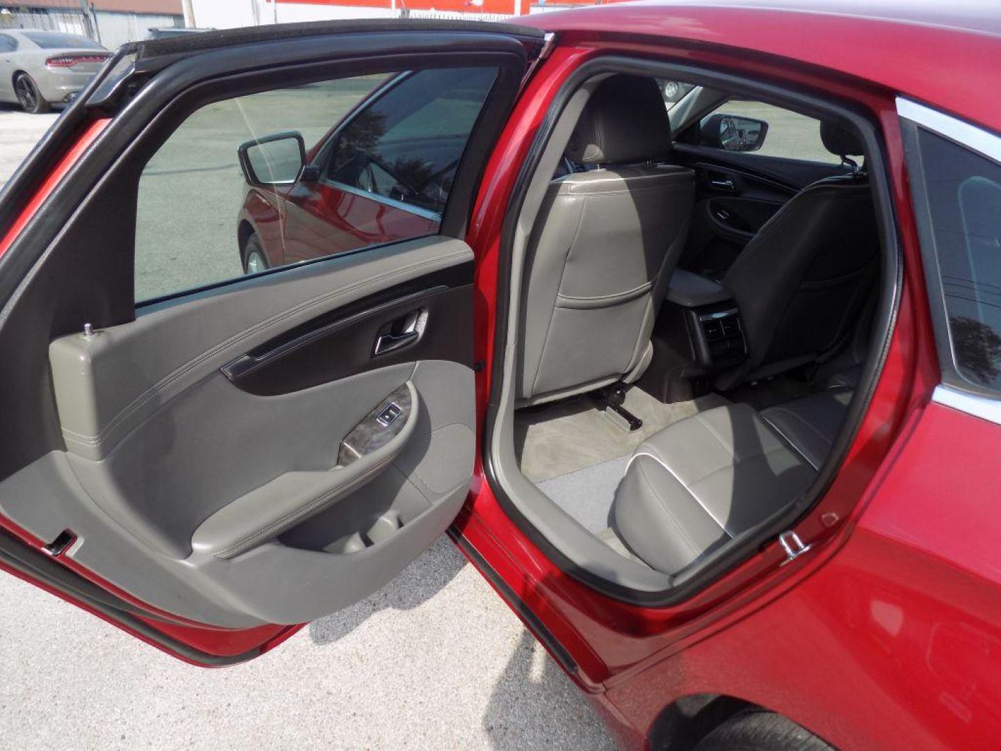 2015 RED CHEVROLET IMPALA LTZ (1G1165S38FU) with an 3.6L engine, Automatic transmission, located at 830 E. Canino Rd., Houston, TX, 77037, (281) 405-0440, 38.358219, -81.729942 - Photo#12