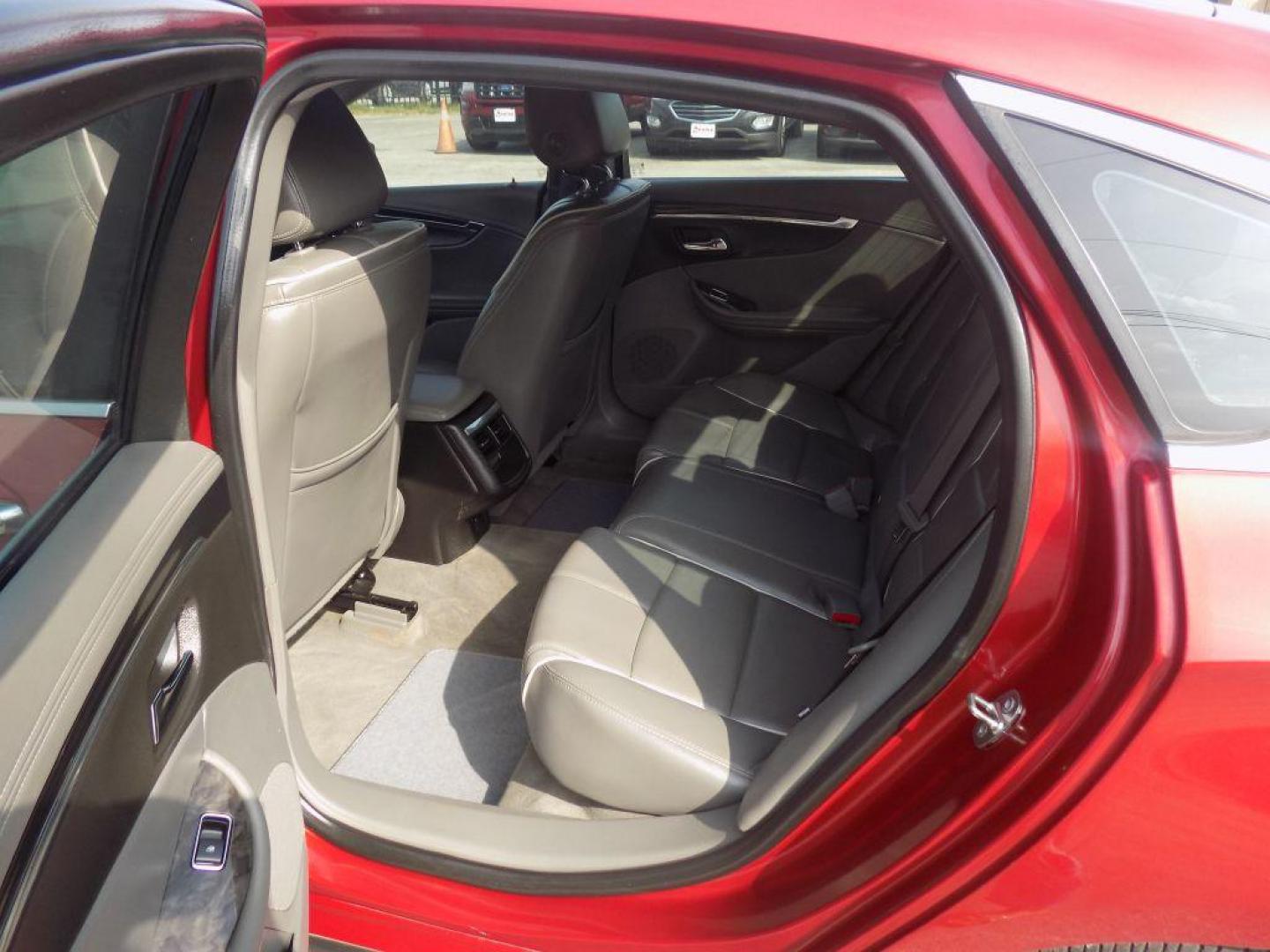 2015 RED CHEVROLET IMPALA LTZ (1G1165S38FU) with an 3.6L engine, Automatic transmission, located at 830 E. Canino Rd., Houston, TX, 77037, (281) 405-0440, 38.358219, -81.729942 - Photo#13