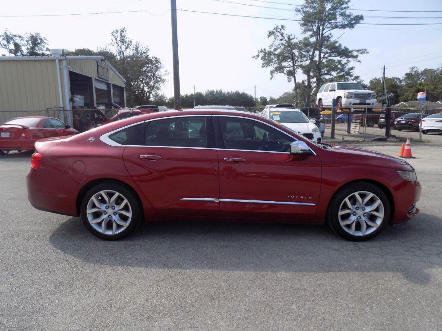 2015 RED CHEVROLET IMPALA LTZ (1G1165S38FU) with an 3.6L engine, Automatic transmission, located at 830 E. Canino Rd., Houston, TX, 77037, (281) 405-0440, 38.358219, -81.729942 - Photo#1
