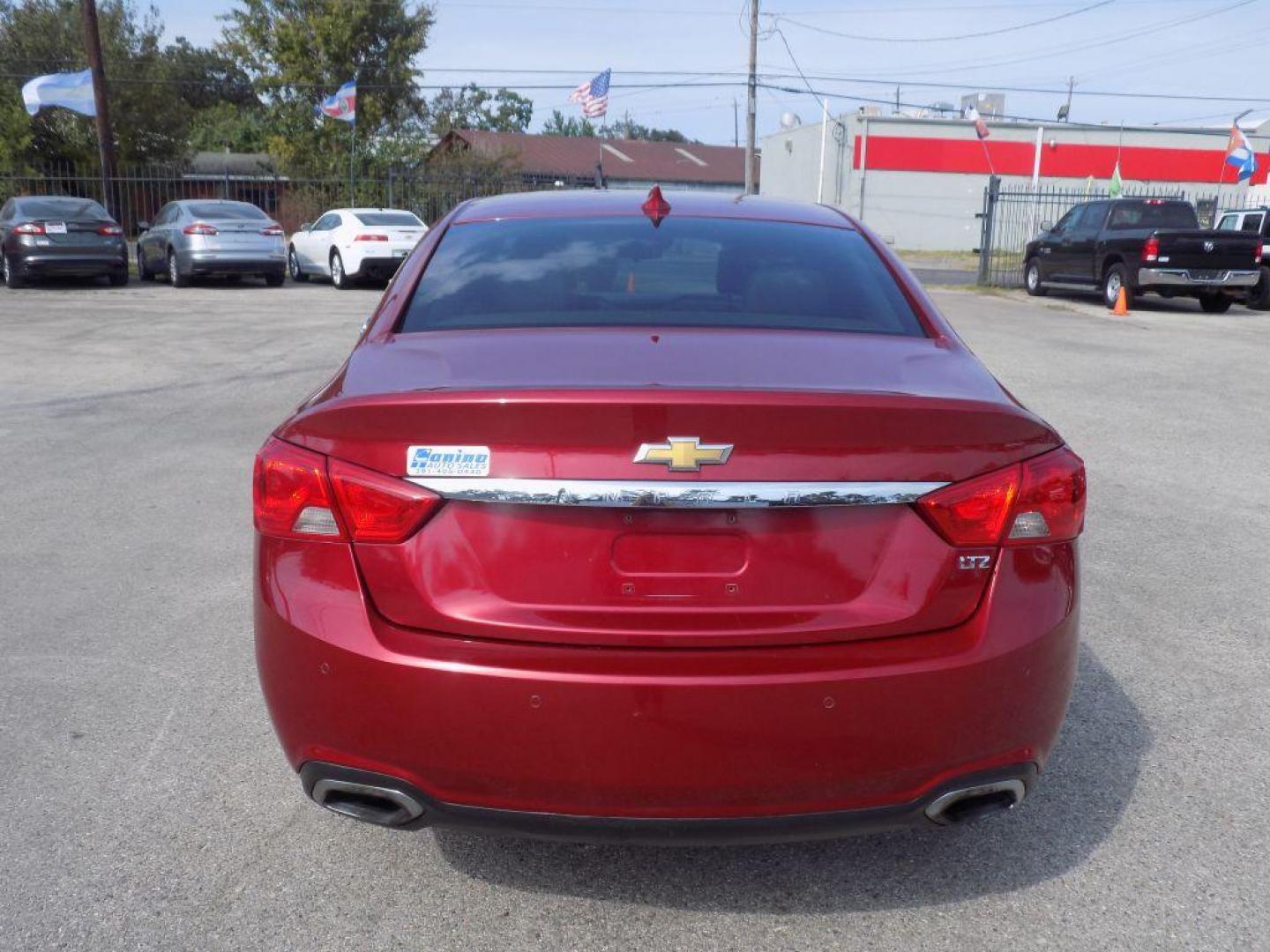 2015 RED CHEVROLET IMPALA LTZ (1G1165S38FU) with an 3.6L engine, Automatic transmission, located at 830 E. Canino Rd., Houston, TX, 77037, (281) 405-0440, 38.358219, -81.729942 - Photo#2