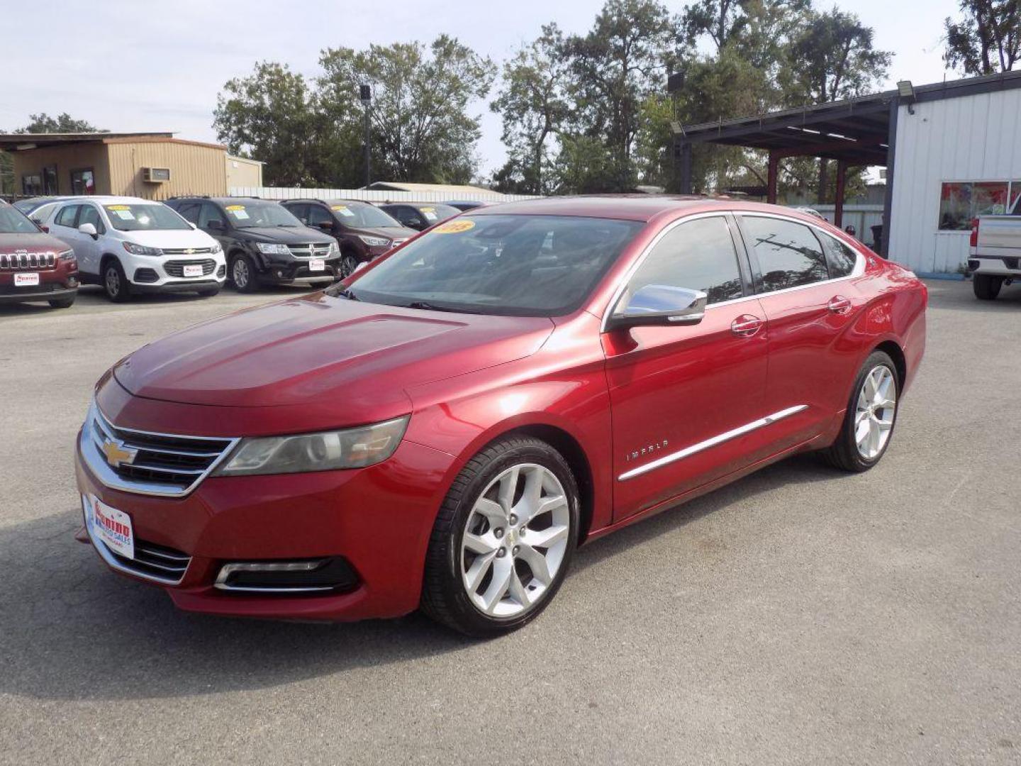2015 RED CHEVROLET IMPALA LTZ (1G1165S38FU) with an 3.6L engine, Automatic transmission, located at 830 E. Canino Rd., Houston, TX, 77037, (281) 405-0440, 38.358219, -81.729942 - Photo#5