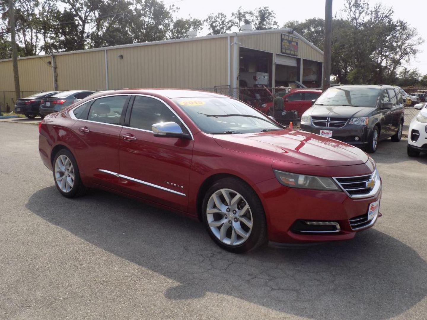 2015 RED CHEVROLET IMPALA LTZ (1G1165S38FU) with an 3.6L engine, Automatic transmission, located at 830 E. Canino Rd., Houston, TX, 77037, (281) 405-0440, 38.358219, -81.729942 - Photo#6