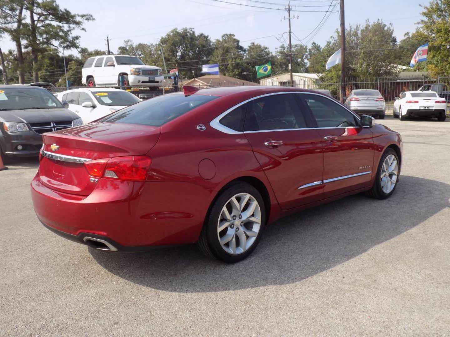 2015 RED CHEVROLET IMPALA LTZ (1G1165S38FU) with an 3.6L engine, Automatic transmission, located at 830 E. Canino Rd., Houston, TX, 77037, (281) 405-0440, 38.358219, -81.729942 - Photo#7