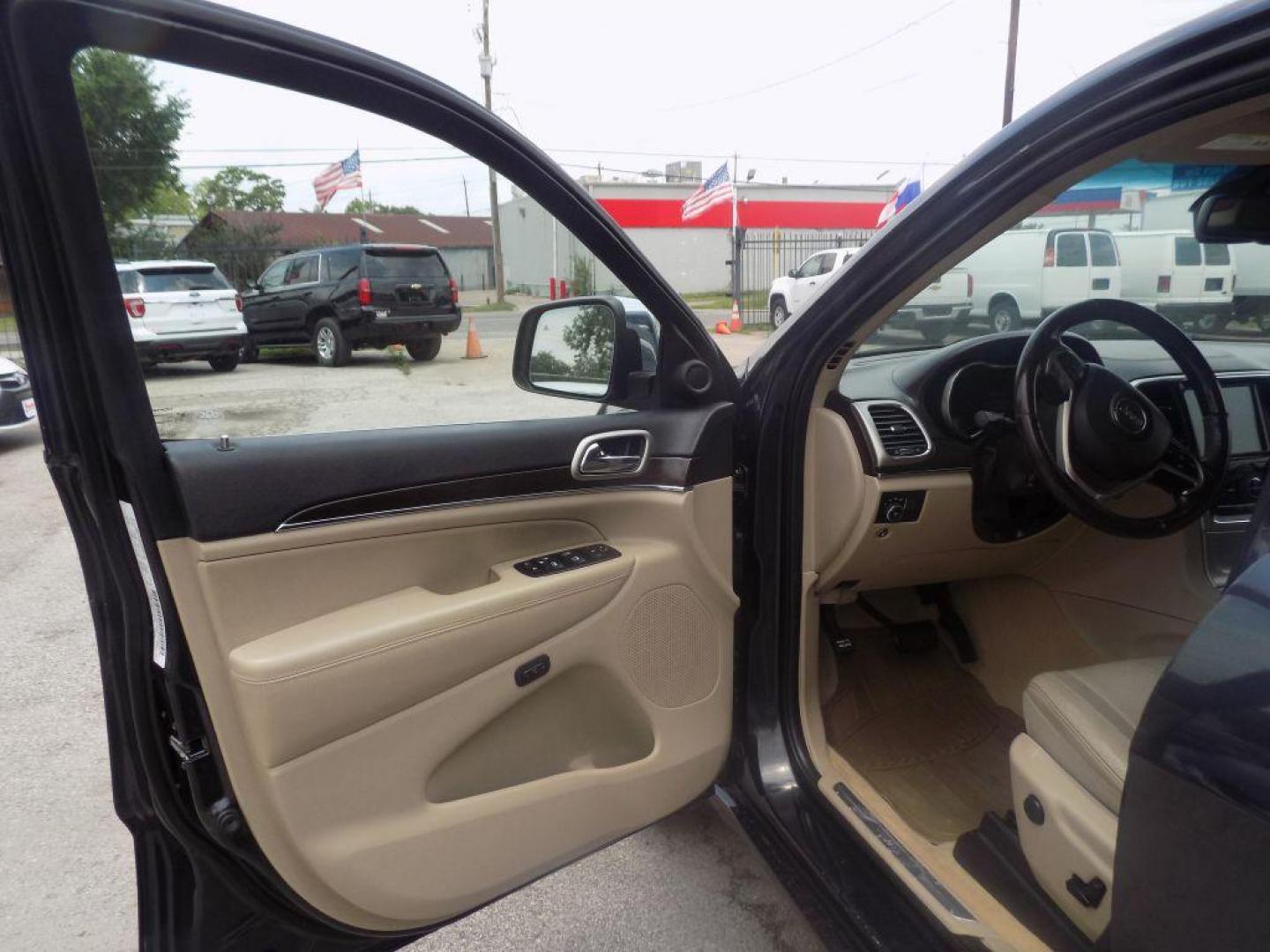 2014 BLACK JEEP GRAND CHEROKEE OVERLAND (1C4RJECT8EC) with an 5.7L engine, Automatic transmission, located at 830 E. Canino Rd., Houston, TX, 77037, (281) 405-0440, 38.358219, -81.729942 - Photo#14