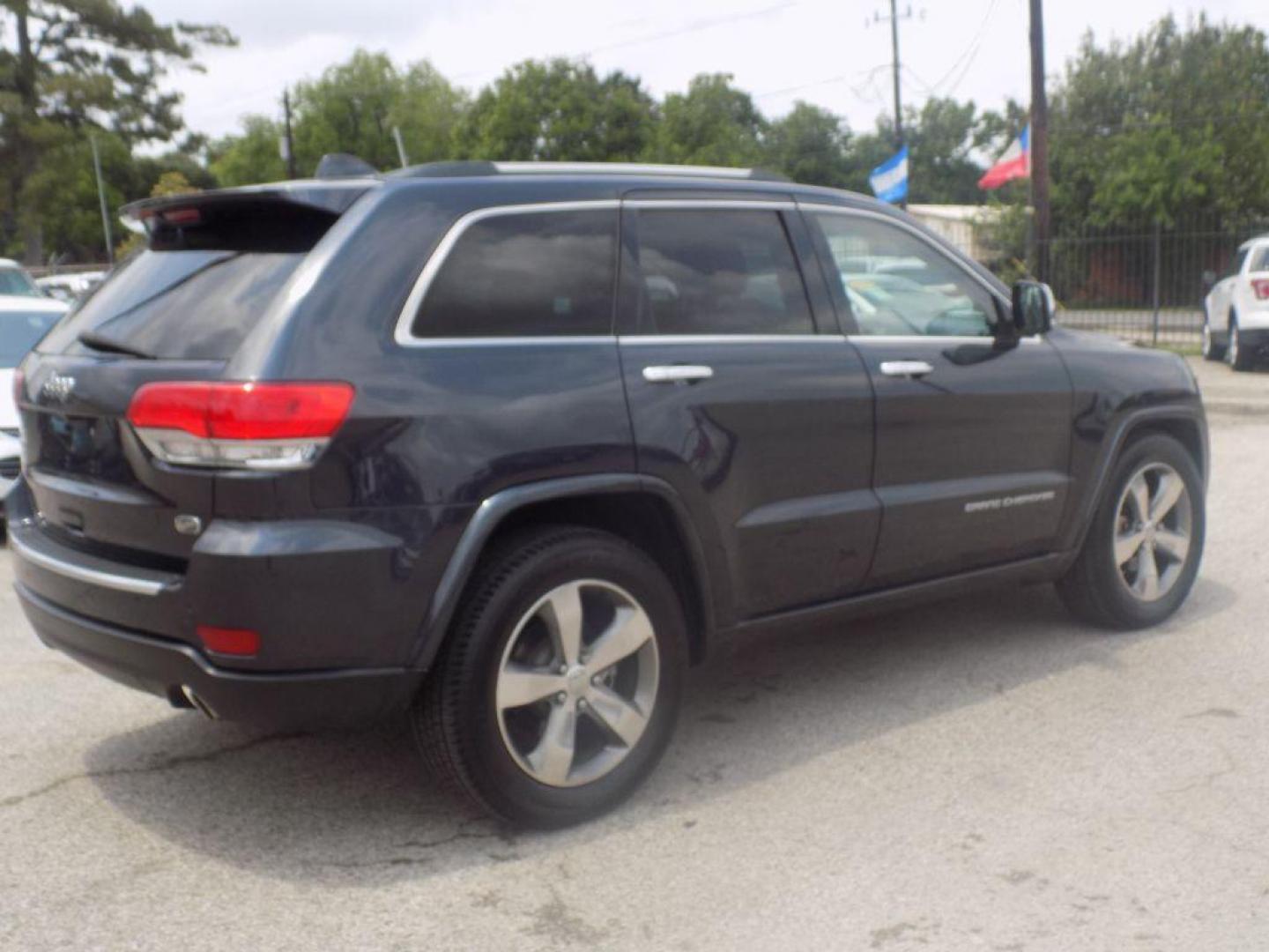 2014 BLACK JEEP GRAND CHEROKEE OVERLAND (1C4RJECT8EC) with an 5.7L engine, Automatic transmission, located at 830 E. Canino Rd., Houston, TX, 77037, (281) 405-0440, 38.358219, -81.729942 - Photo#1