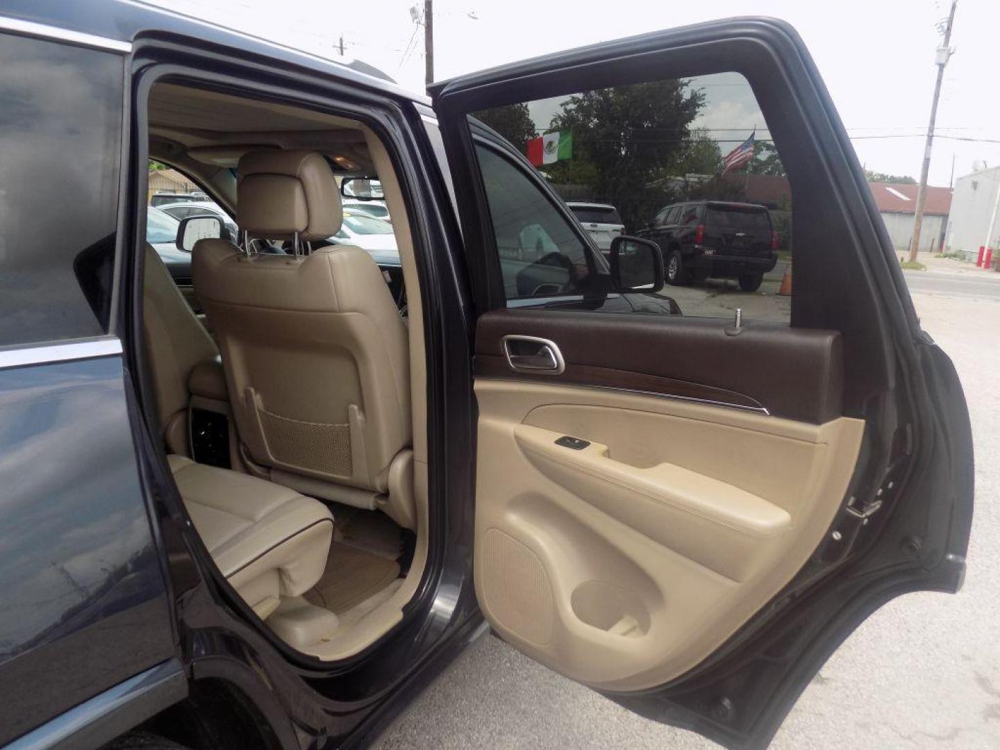 2014 BLACK JEEP GRAND CHEROKEE OVERLAND (1C4RJECT8EC) with an 5.7L engine, Automatic transmission, located at 830 E. Canino Rd., Houston, TX, 77037, (281) 405-0440, 38.358219, -81.729942 - Photo#20