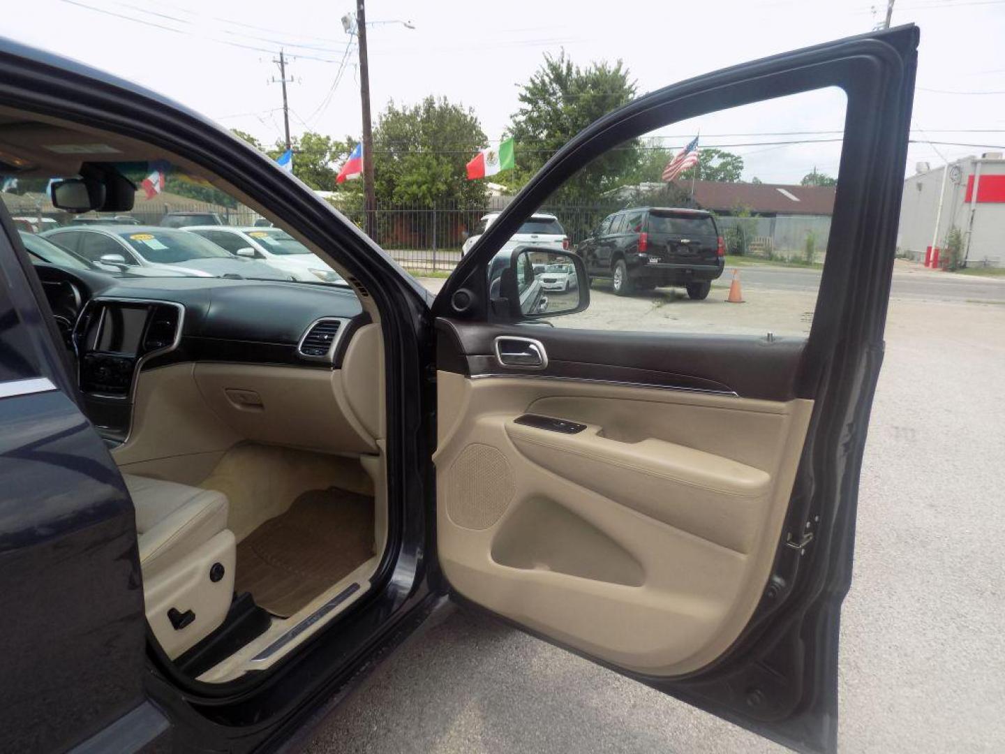 2014 BLACK JEEP GRAND CHEROKEE OVERLAND (1C4RJECT8EC) with an 5.7L engine, Automatic transmission, located at 830 E. Canino Rd., Houston, TX, 77037, (281) 405-0440, 38.358219, -81.729942 - Photo#22
