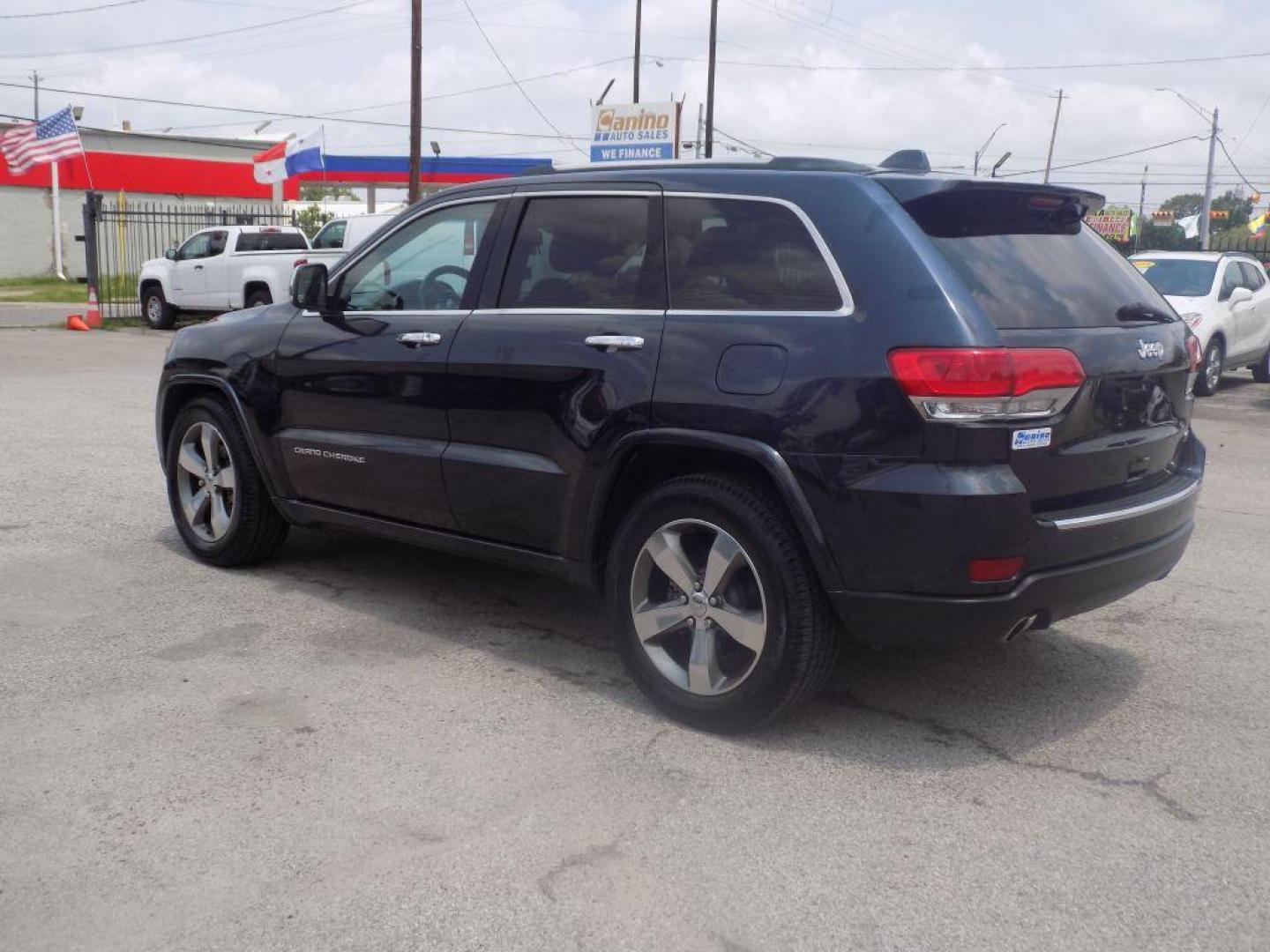 2014 BLACK JEEP GRAND CHEROKEE OVERLAND (1C4RJECT8EC) with an 5.7L engine, Automatic transmission, located at 830 E. Canino Rd., Houston, TX, 77037, (281) 405-0440, 38.358219, -81.729942 - Photo#4