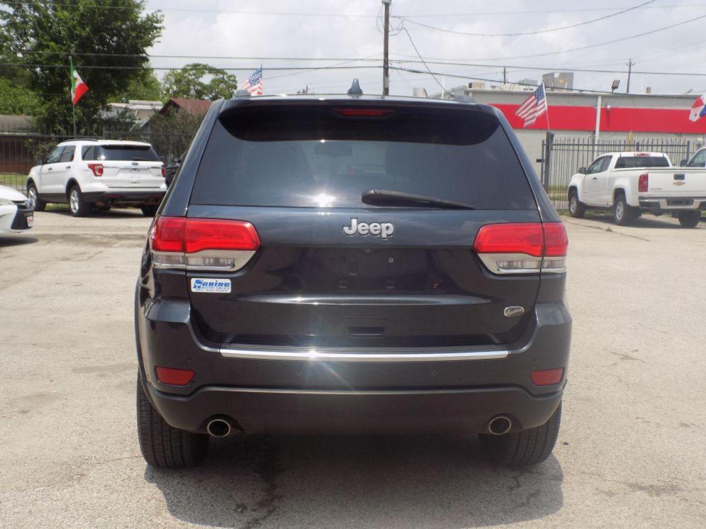 2014 BLACK JEEP GRAND CHEROKEE OVERLAND (1C4RJECT8EC) with an 5.7L engine, Automatic transmission, located at 830 E. Canino Rd., Houston, TX, 77037, (281) 405-0440, 38.358219, -81.729942 - Photo#5
