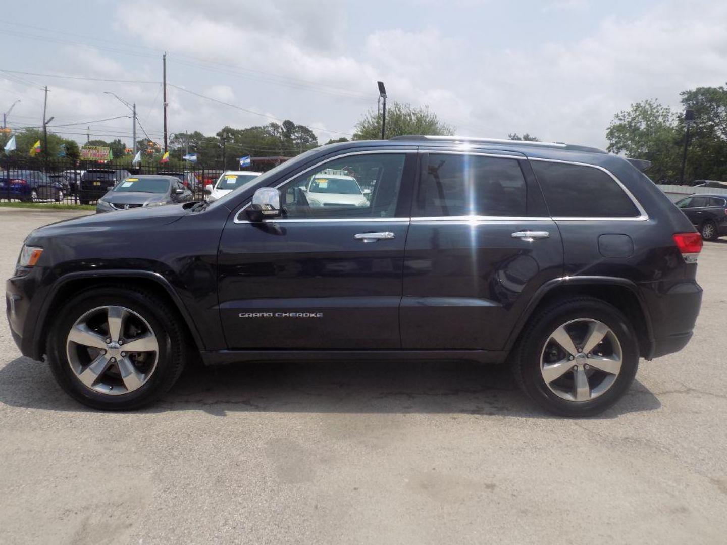 2014 BLACK JEEP GRAND CHEROKEE OVERLAND (1C4RJECT8EC) with an 5.7L engine, Automatic transmission, located at 830 E. Canino Rd., Houston, TX, 77037, (281) 405-0440, 38.358219, -81.729942 - Photo#6