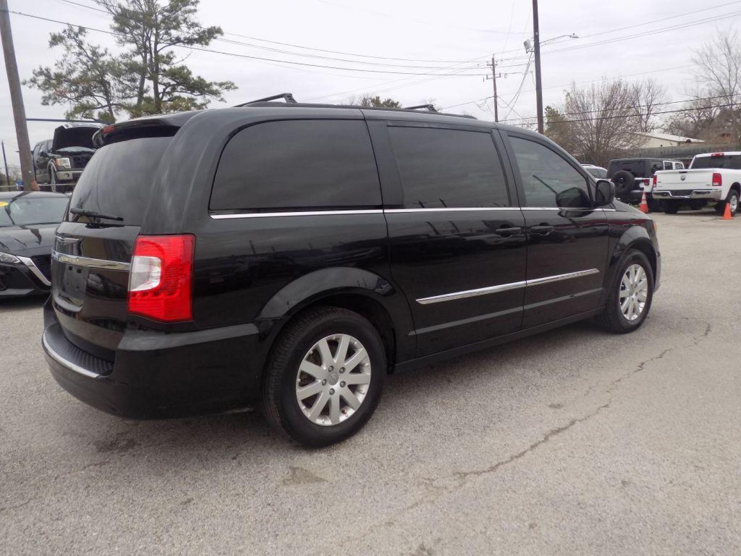 2016 BLACK CHRYSLER TOWN and COUNTRY TOURING (2C4RC1BG4GR) with an 3.6L engine, Automatic transmission, located at 830 E. Canino Rd., Houston, TX, 77037, (281) 405-0440, 38.358219, -81.729942 - Photo#2