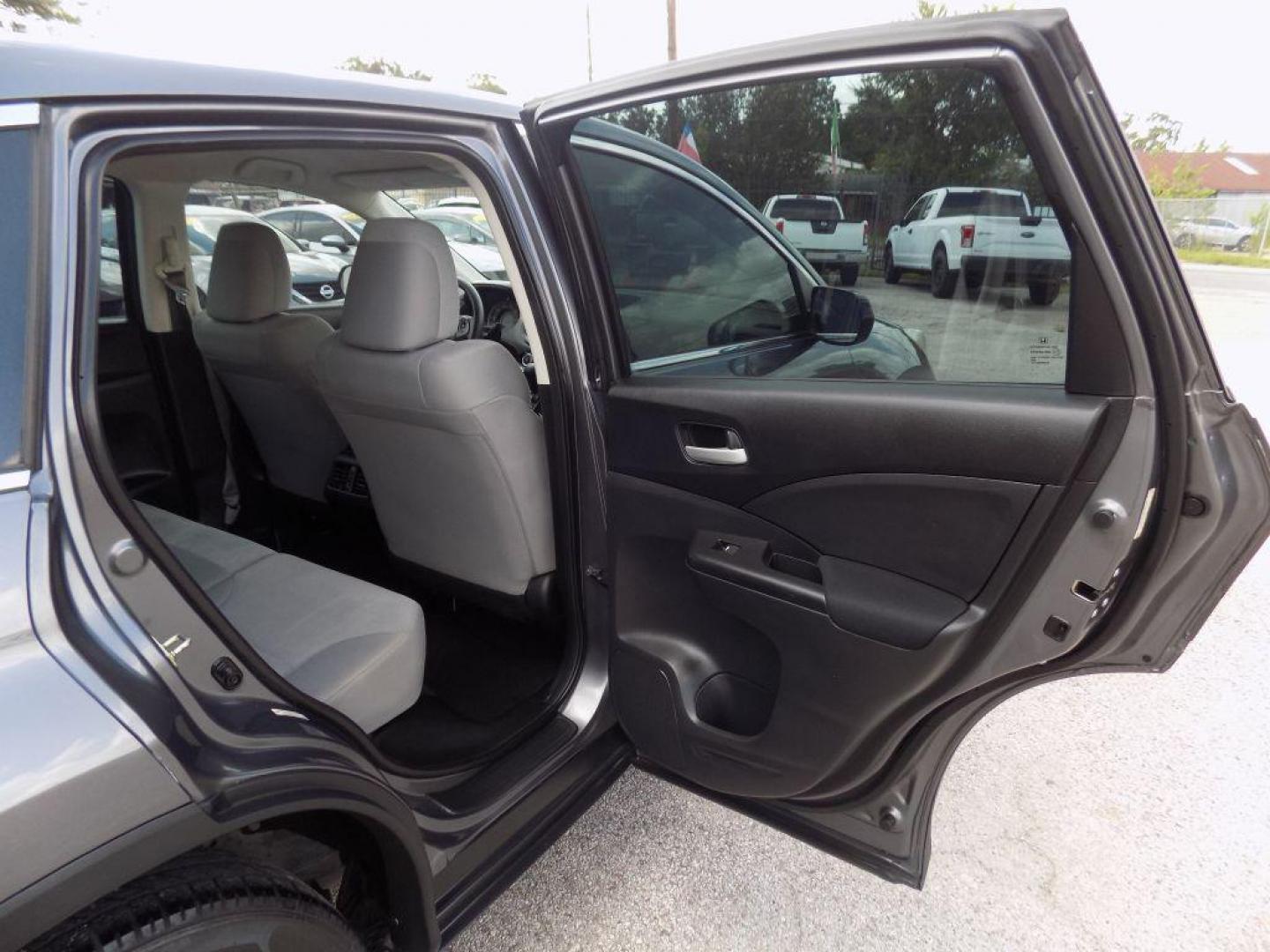 2015 GRAY HONDA CR-V LX (2HKRM3H39FH) with an 2.4L engine, Continuously Variable transmission, located at 830 E. Canino Rd., Houston, TX, 77037, (281) 405-0440, 38.358219, -81.729942 - Photo#10