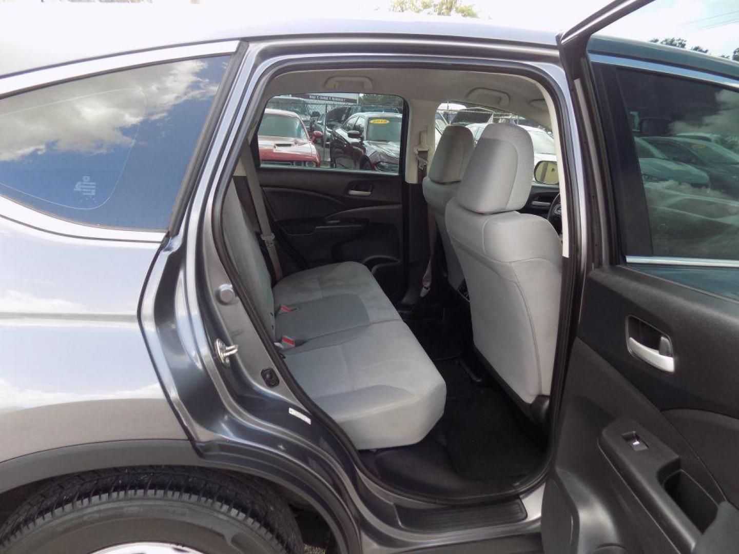 2015 GRAY HONDA CR-V LX (2HKRM3H39FH) with an 2.4L engine, Continuously Variable transmission, located at 830 E. Canino Rd., Houston, TX, 77037, (281) 405-0440, 38.358219, -81.729942 - Photo#11