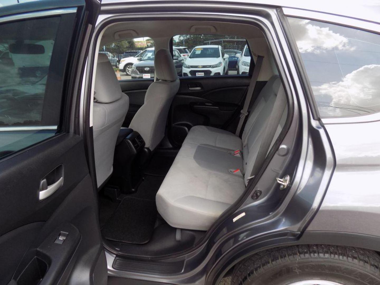 2015 GRAY HONDA CR-V LX (2HKRM3H39FH) with an 2.4L engine, Continuously Variable transmission, located at 830 E. Canino Rd., Houston, TX, 77037, (281) 405-0440, 38.358219, -81.729942 - Photo#13