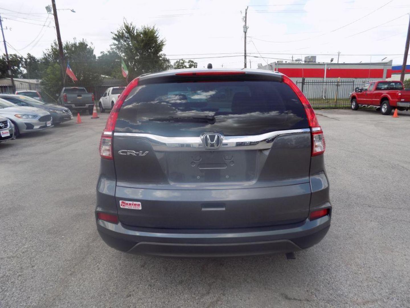 2015 GRAY HONDA CR-V LX (2HKRM3H39FH) with an 2.4L engine, Continuously Variable transmission, located at 830 E. Canino Rd., Houston, TX, 77037, (281) 405-0440, 38.358219, -81.729942 - Photo#2