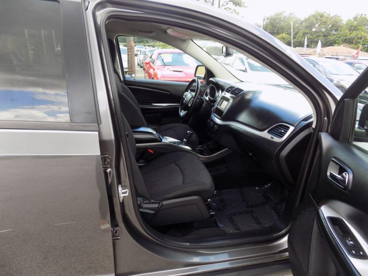 2016 GRAY DODGE JOURNEY SE (3C4PDCAB8GT) with an 2.4L engine, Automatic transmission, located at 830 E. Canino Rd., Houston, TX, 77037, (281) 405-0440, 38.358219, -81.729942 - Photo#9