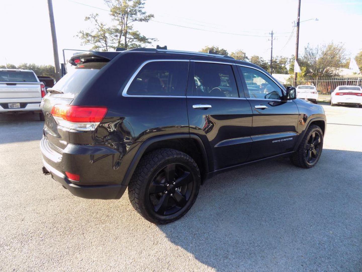 2015 BLACK JEEP GRAND CHEROKEE LIMITED (1C4RJFBG2FC) with an 3.6L engine, Automatic transmission, located at 830 E. Canino Rd., Houston, TX, 77037, (281) 405-0440, 38.358219, -81.729942 - Photo#7