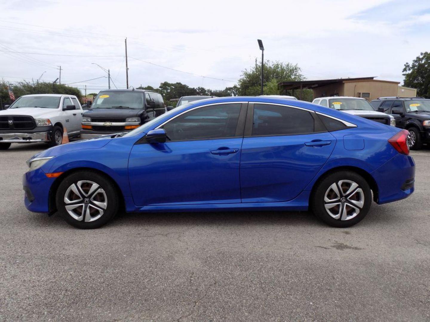 2017 BLUE HONDA CIVIC LX (19XFC2F52HE) with an 2.0L engine, Continuously Variable transmission, located at 830 E. Canino Rd., Houston, TX, 77037, (281) 405-0440, 38.358219, -81.729942 - RCVD TITLE - Photo#2