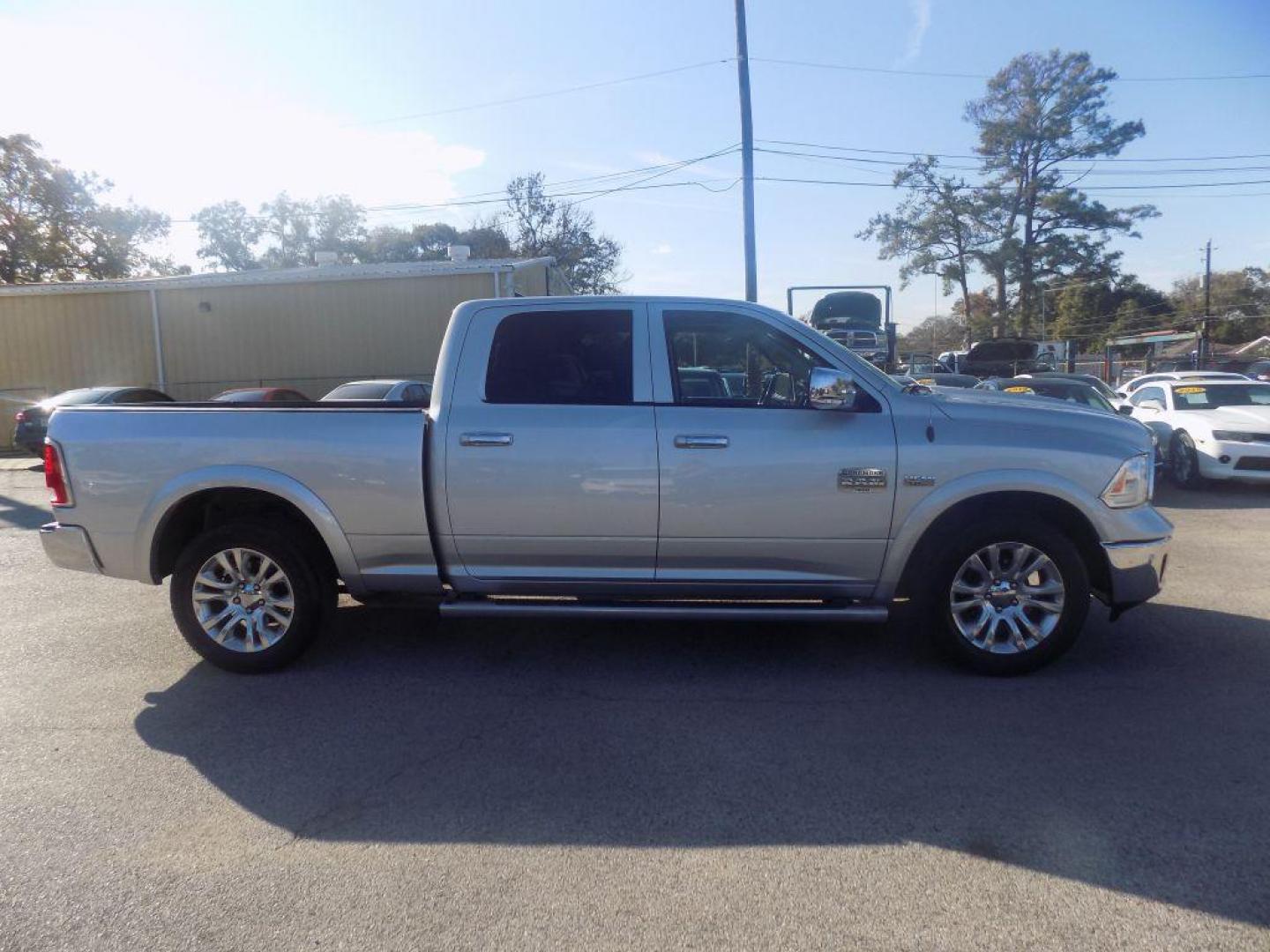 2015 SILVER RAM 1500 LONGHORN (1C6RR6WT8FS) with an 5.7L engine, Automatic transmission, located at 830 E. Canino Rd., Houston, TX, 77037, (281) 405-0440, 38.358219, -81.729942 - Photo#1