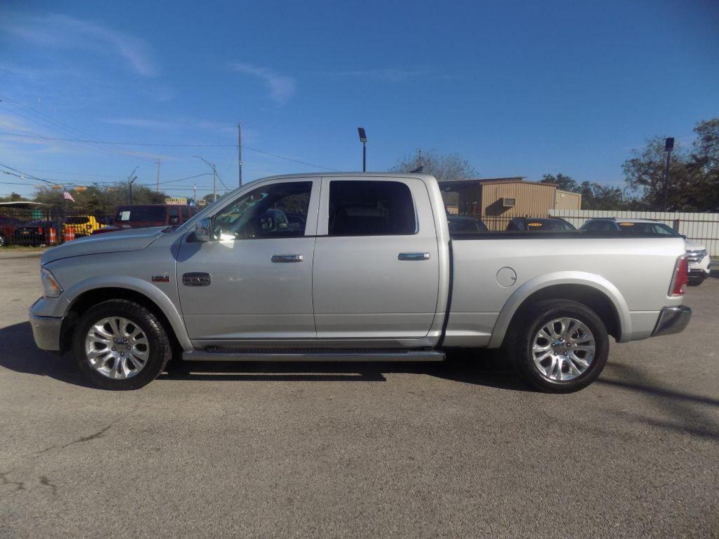 2015 SILVER RAM 1500 LONGHORN (1C6RR6WT8FS) with an 5.7L engine, Automatic transmission, located at 830 E. Canino Rd., Houston, TX, 77037, (281) 405-0440, 38.358219, -81.729942 - Photo#3