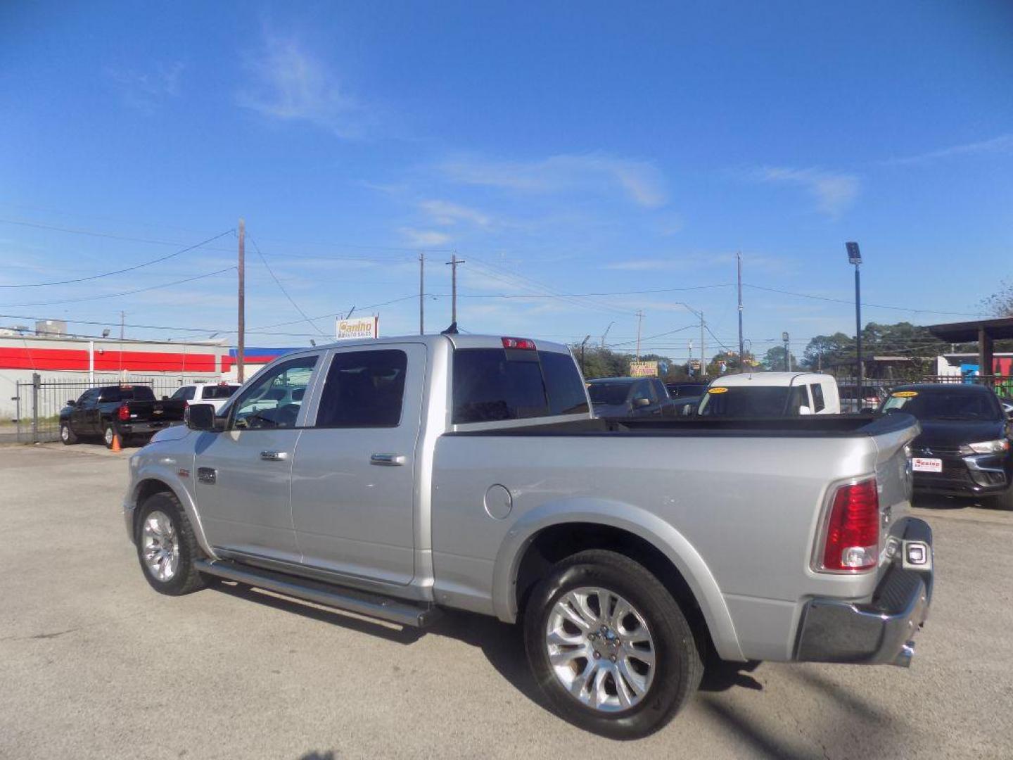2015 SILVER RAM 1500 LONGHORN (1C6RR6WT8FS) with an 5.7L engine, Automatic transmission, located at 830 E. Canino Rd., Houston, TX, 77037, (281) 405-0440, 38.358219, -81.729942 - Photo#4
