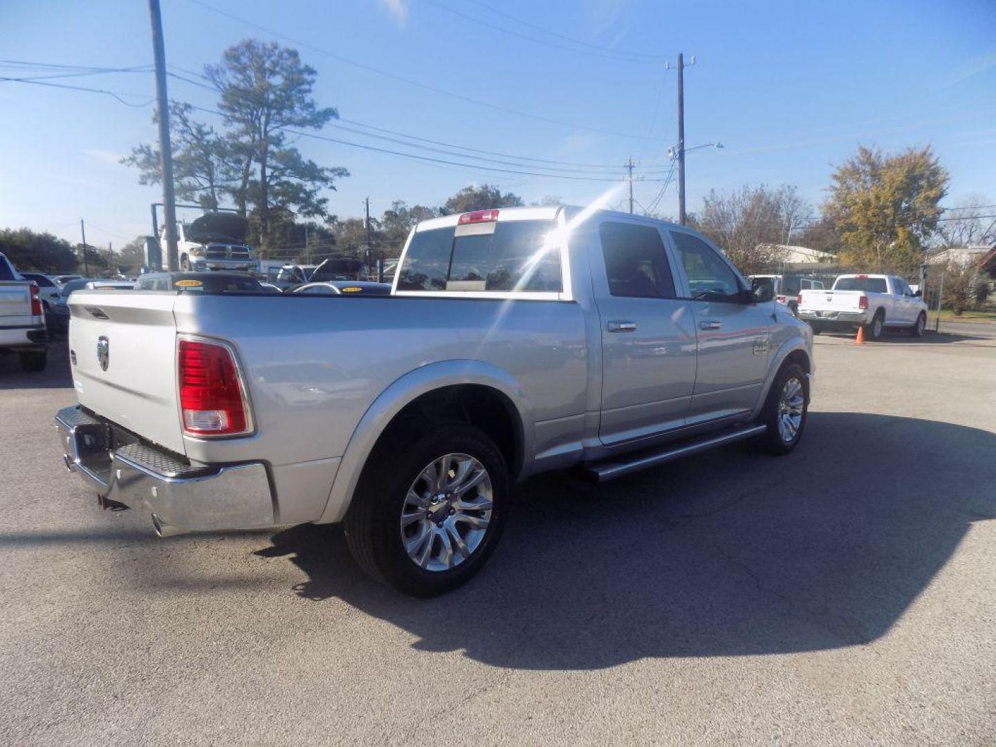 2015 SILVER RAM 1500 LONGHORN (1C6RR6WT8FS) with an 5.7L engine, Automatic transmission, located at 830 E. Canino Rd., Houston, TX, 77037, (281) 405-0440, 38.358219, -81.729942 - Photo#7