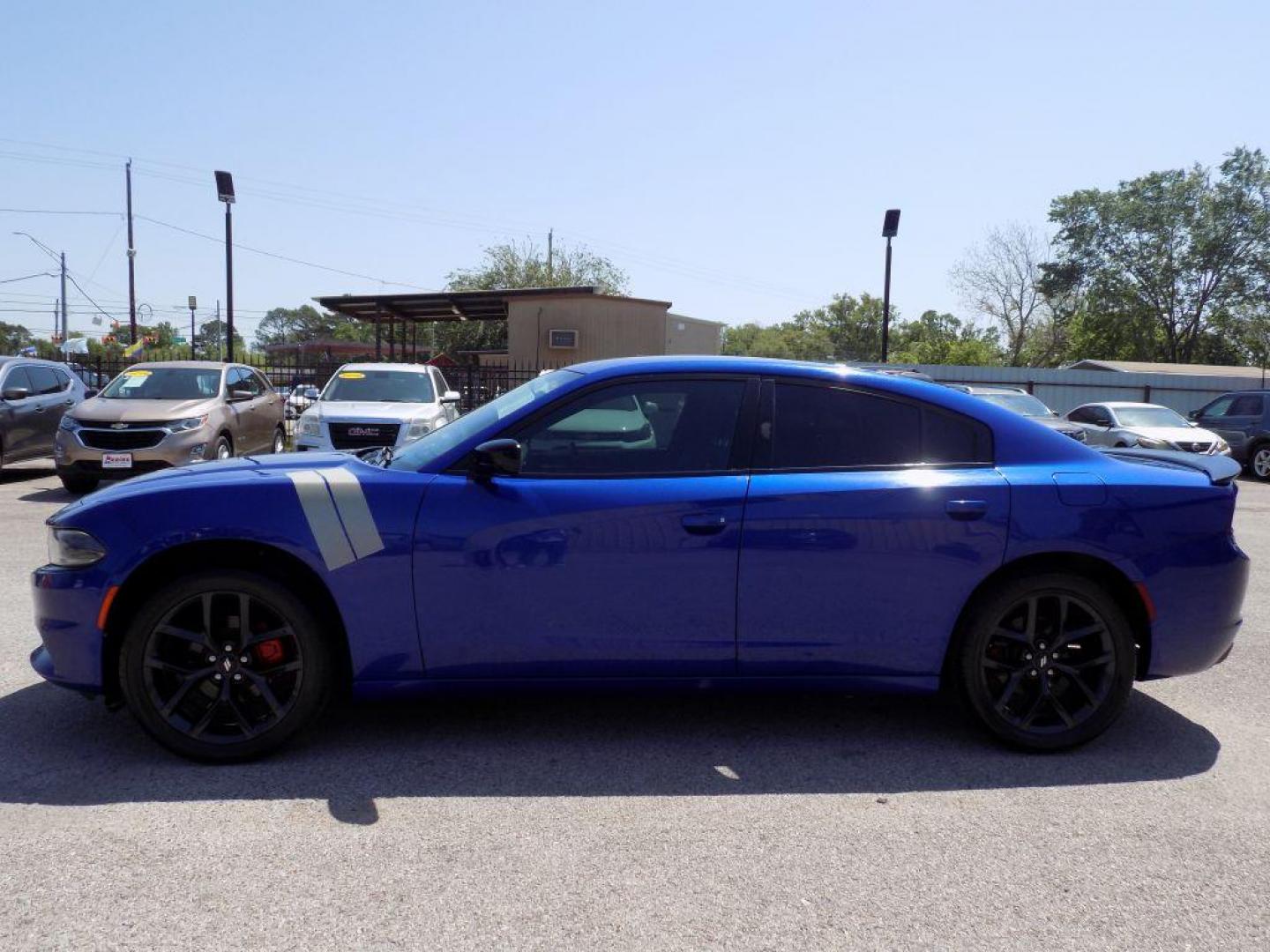 2019 BLUE DODGE CHARGER SXT (2C3CDXBG3KH) with an 3.6L engine, Automatic transmission, located at 830 E. Canino Rd., Houston, TX, 77037, (281) 405-0440, 38.358219, -81.729942 - Photo#2