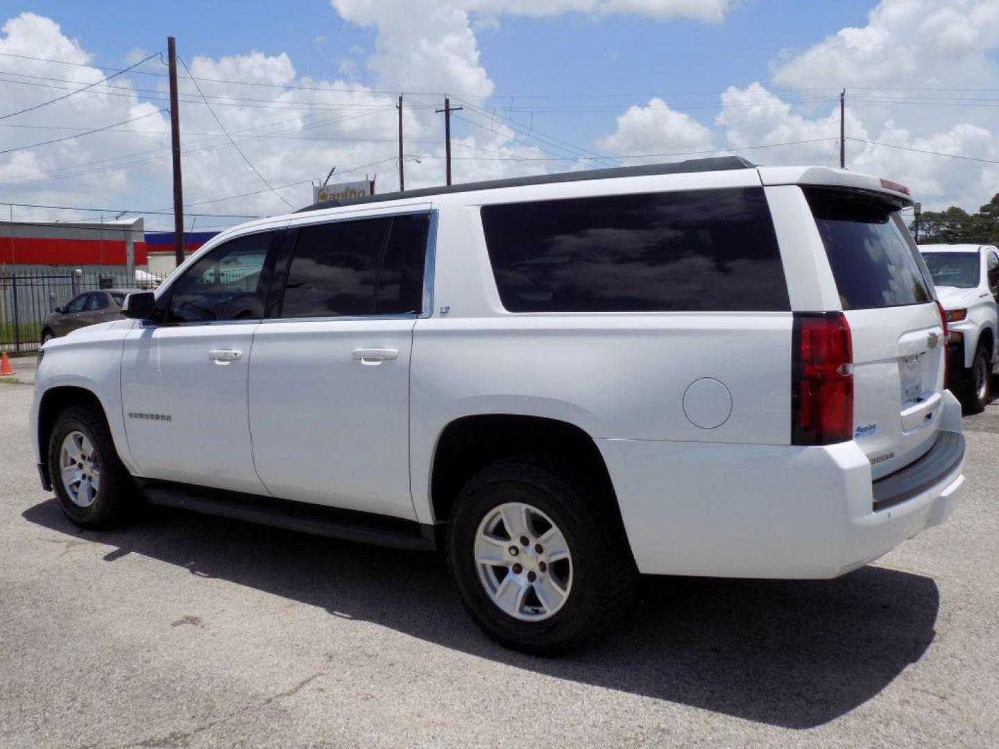 2016 WHITE CHEVROLET SUBURBAN 1500 LT (1GNSCHKC0GR) with an 5.3L engine, Automatic transmission, located at 830 E. Canino Rd., Houston, TX, 77037, (281) 405-0440, 38.358219, -81.729942 - Photo#3