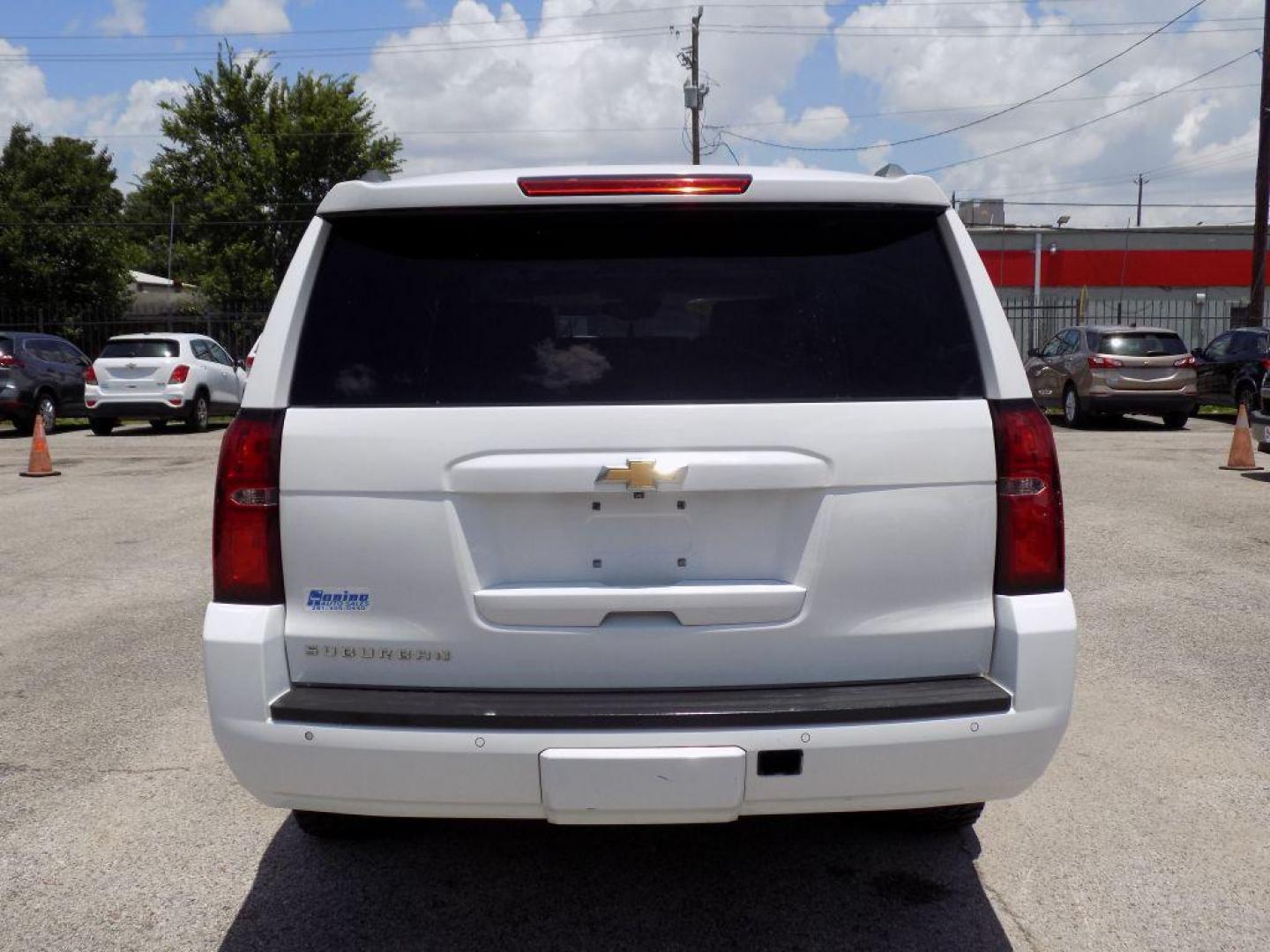 2016 WHITE CHEVROLET SUBURBAN 1500 LT (1GNSCHKC0GR) with an 5.3L engine, Automatic transmission, located at 830 E. Canino Rd., Houston, TX, 77037, (281) 405-0440, 38.358219, -81.729942 - Photo#4